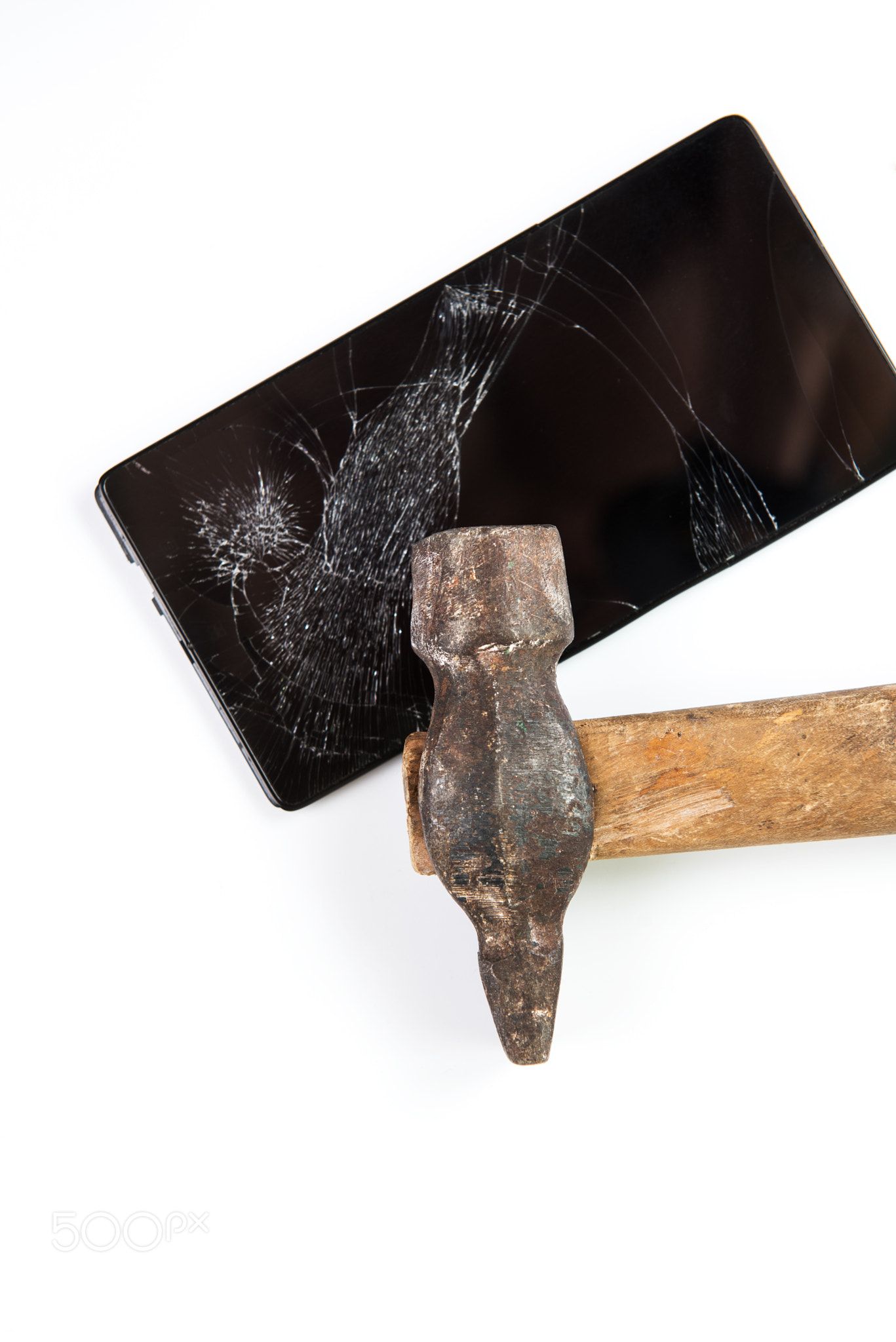 An old hammer and smartphone