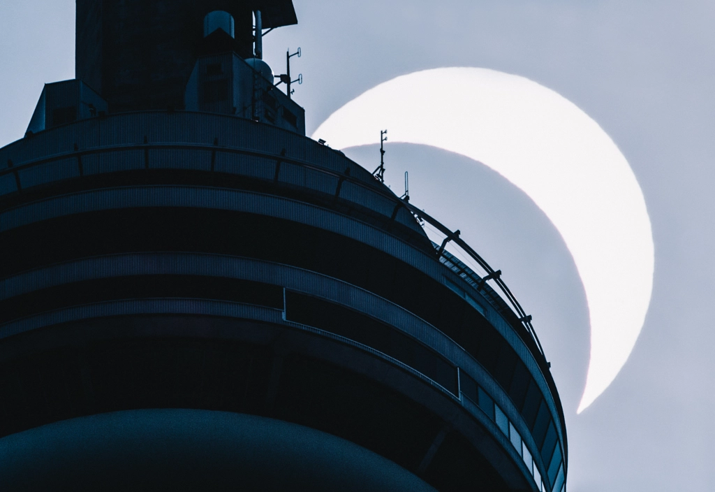 Solar Eclipse behind the CN Tower by Jon Simonassi on 500px.com