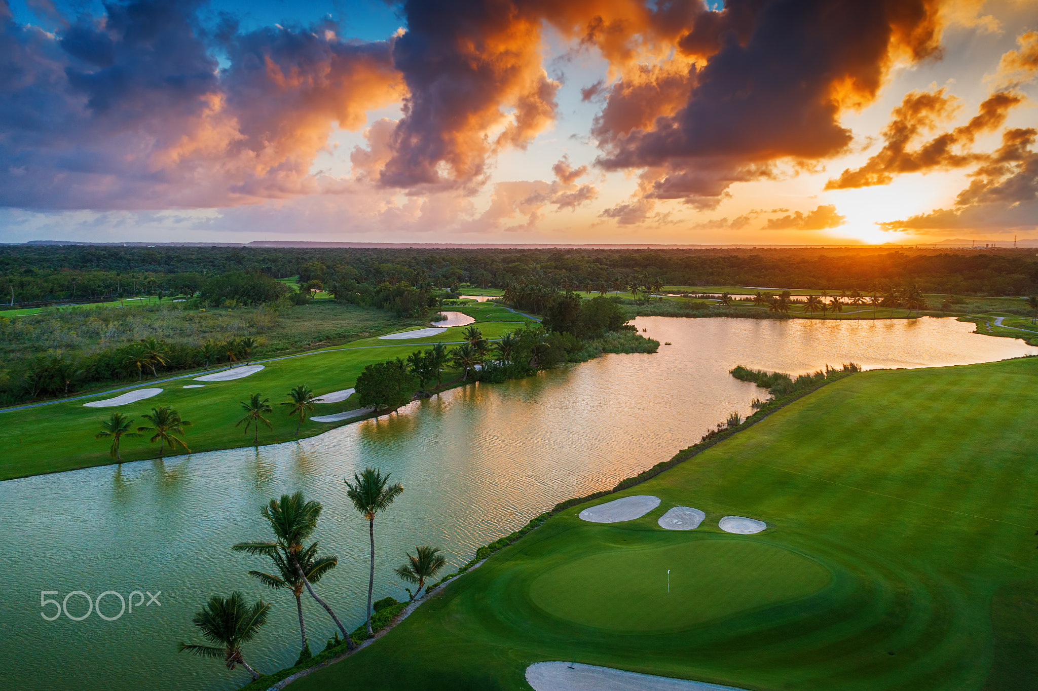 Aerial view of tropical golf course at sunset, Dominican Republi