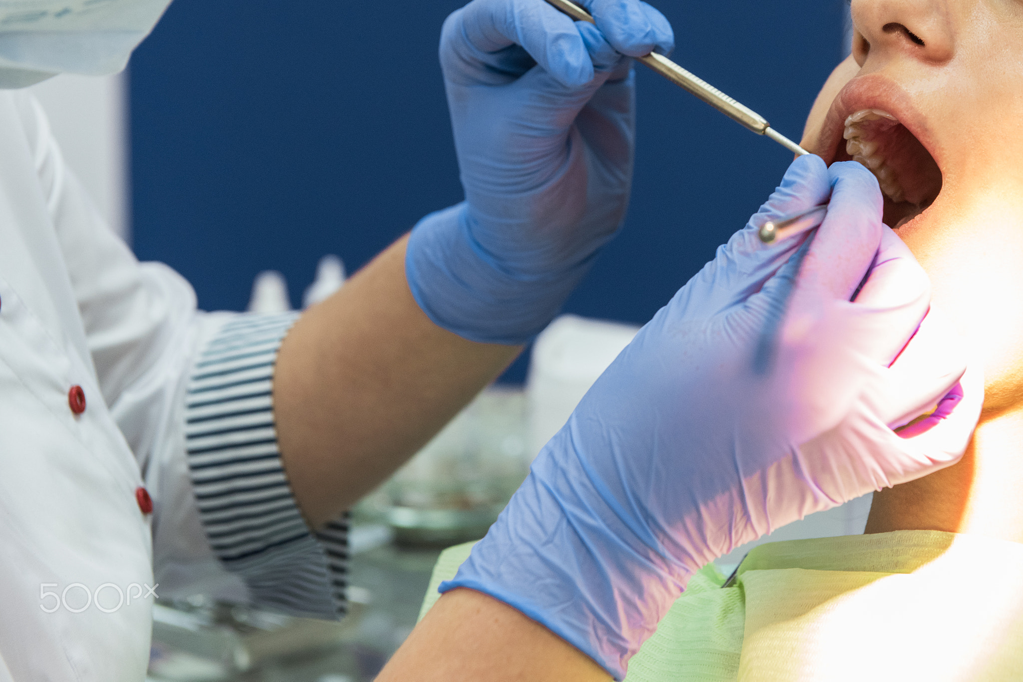 Dentist working in dentist office
