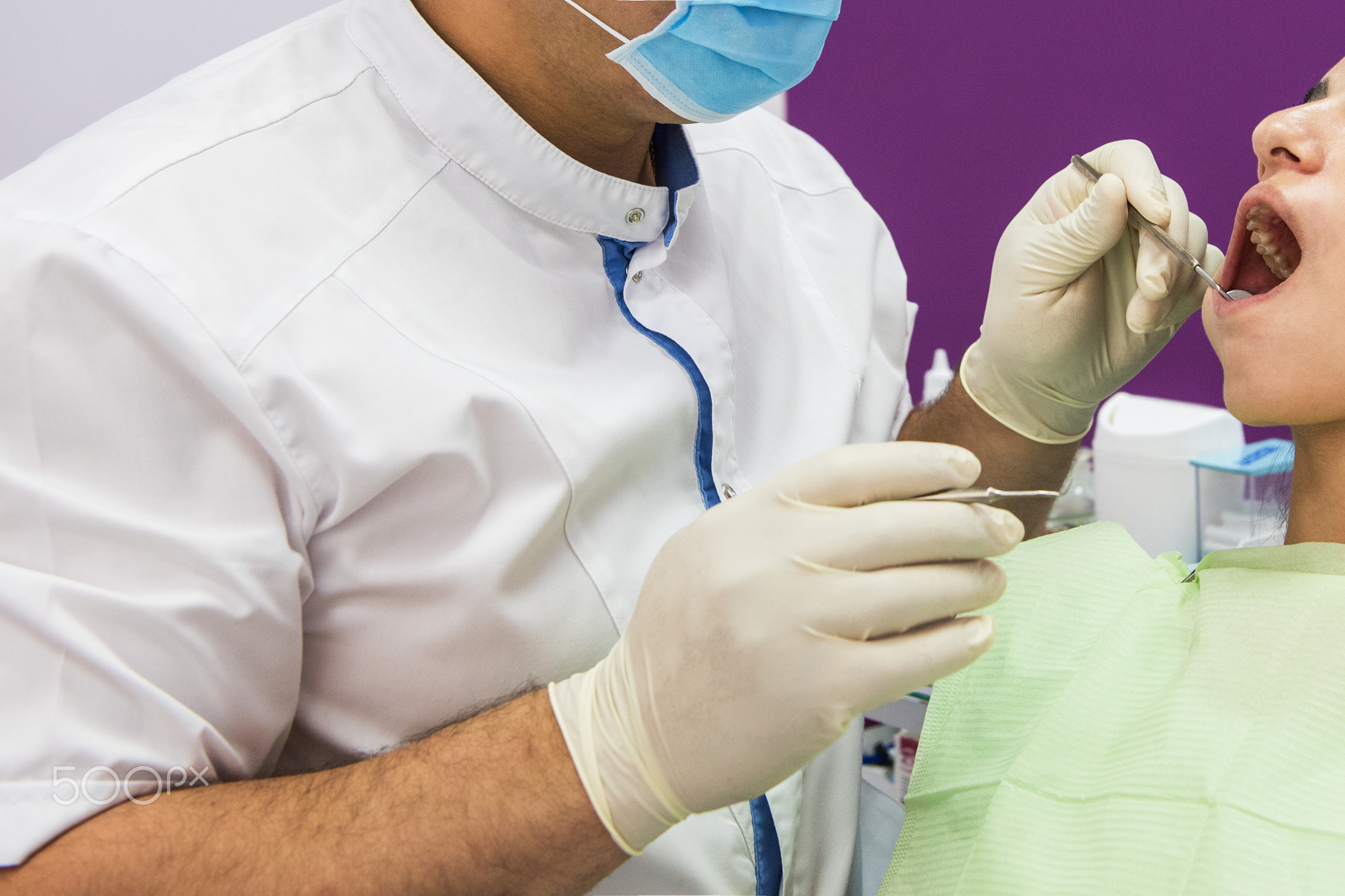 Dentist working in dentist office