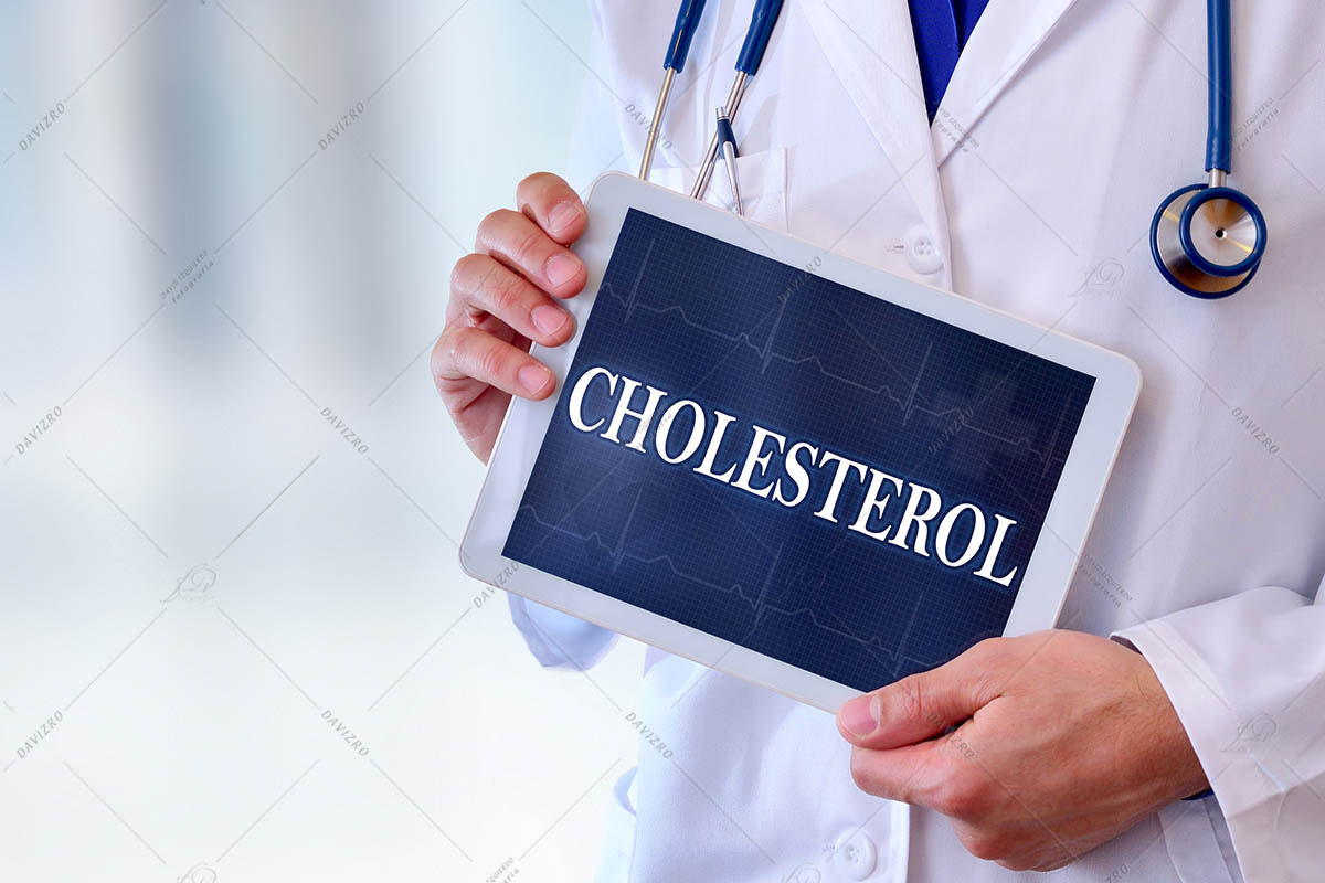 Doctor with tablet with cholesterol message