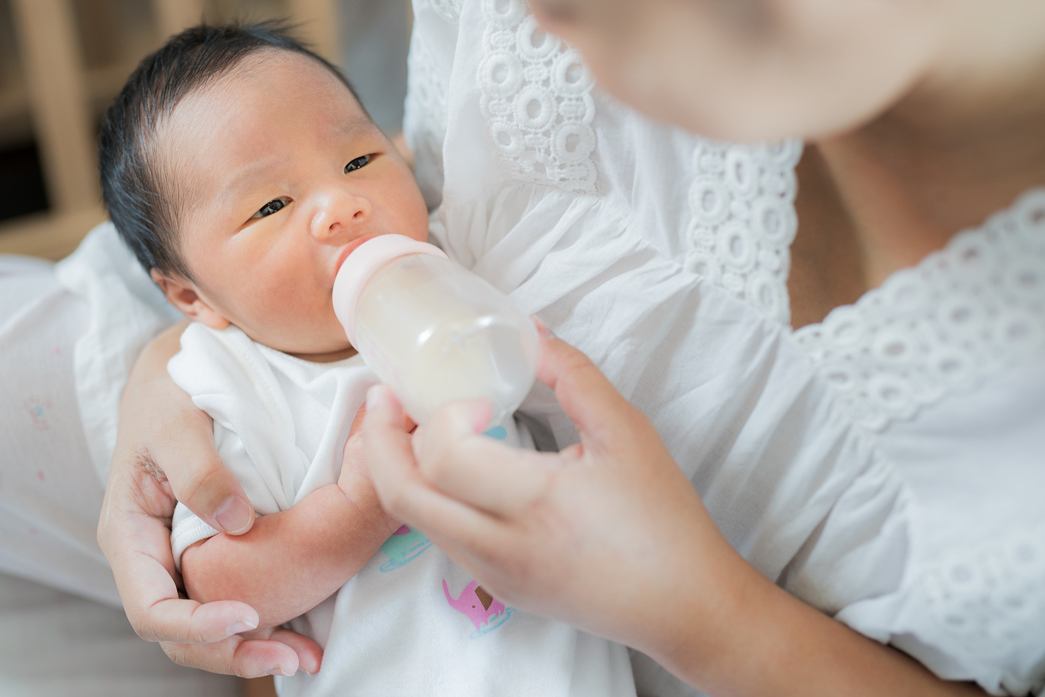 Mother takecare asian new born baby