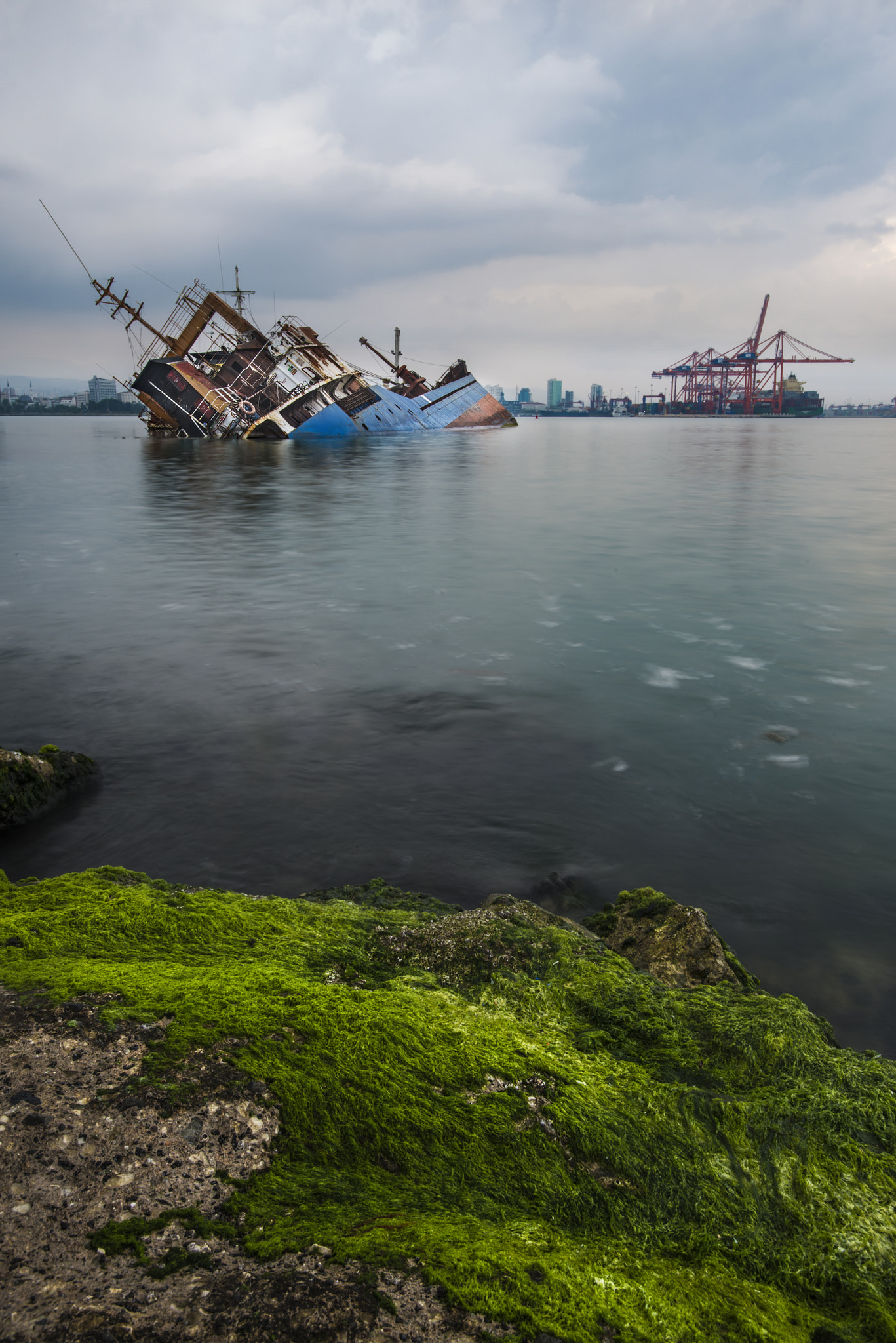 Sinking ship. Industrial sea port of Mersin. Turkey