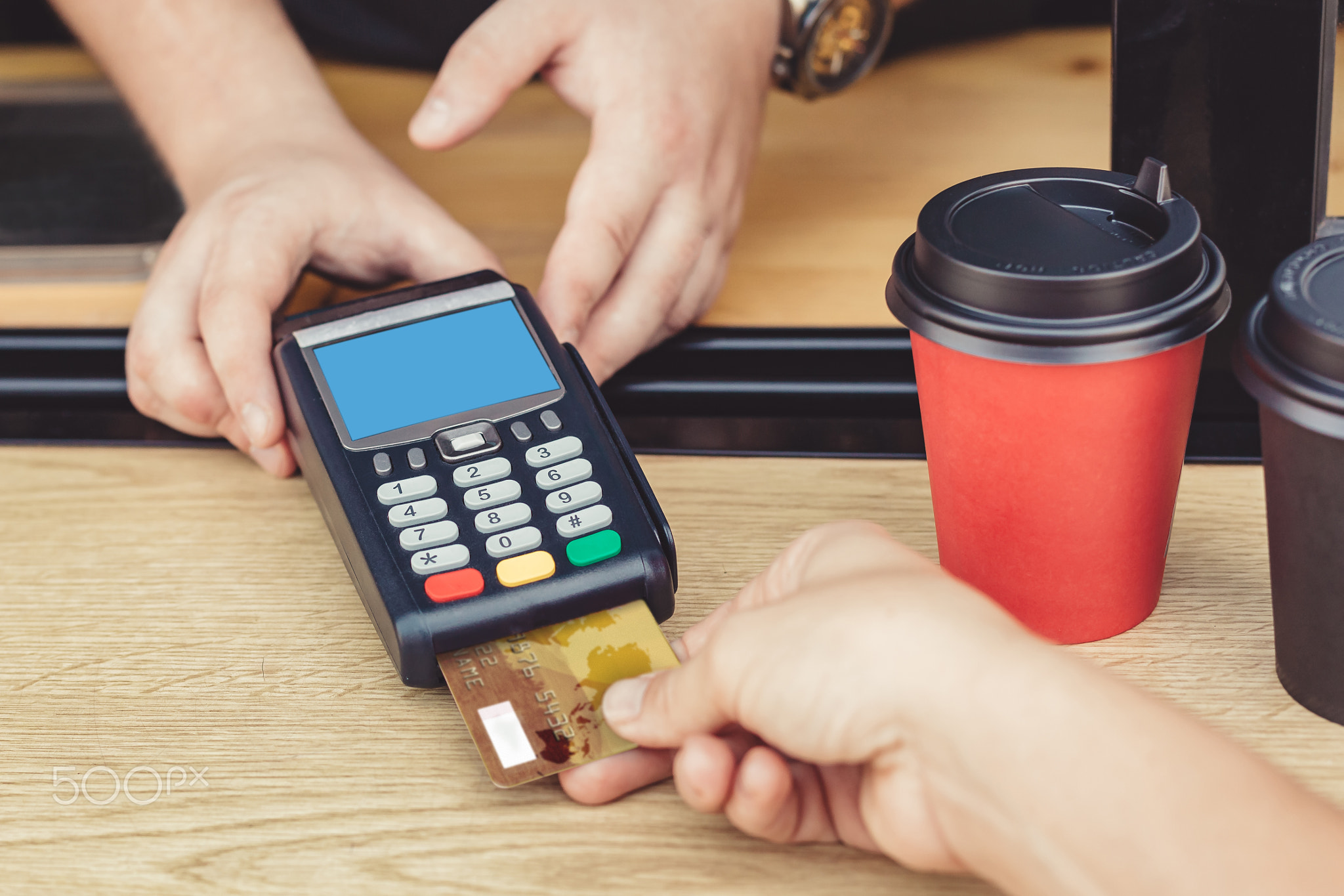 Person paying bill in cafe