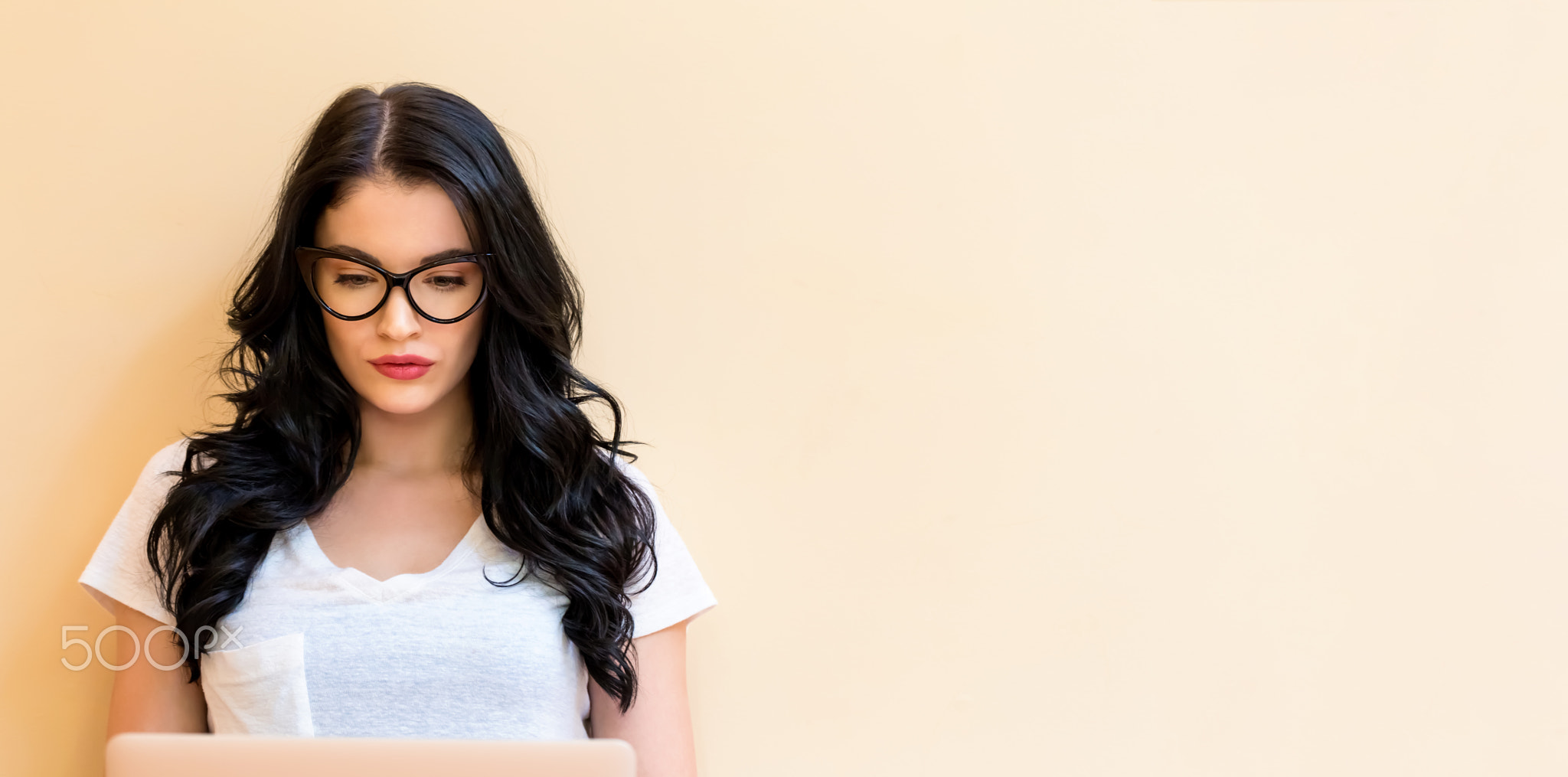 Young woman using her laptop