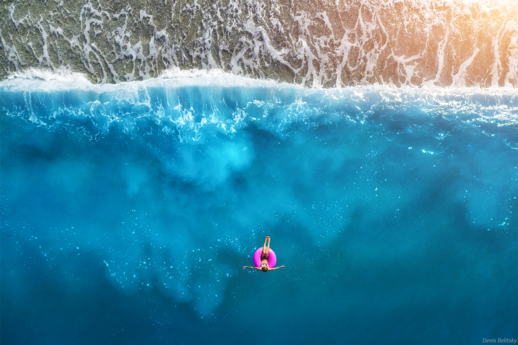 Aerial view of young woman swimming by Denys Bilytskyi on 500px.com