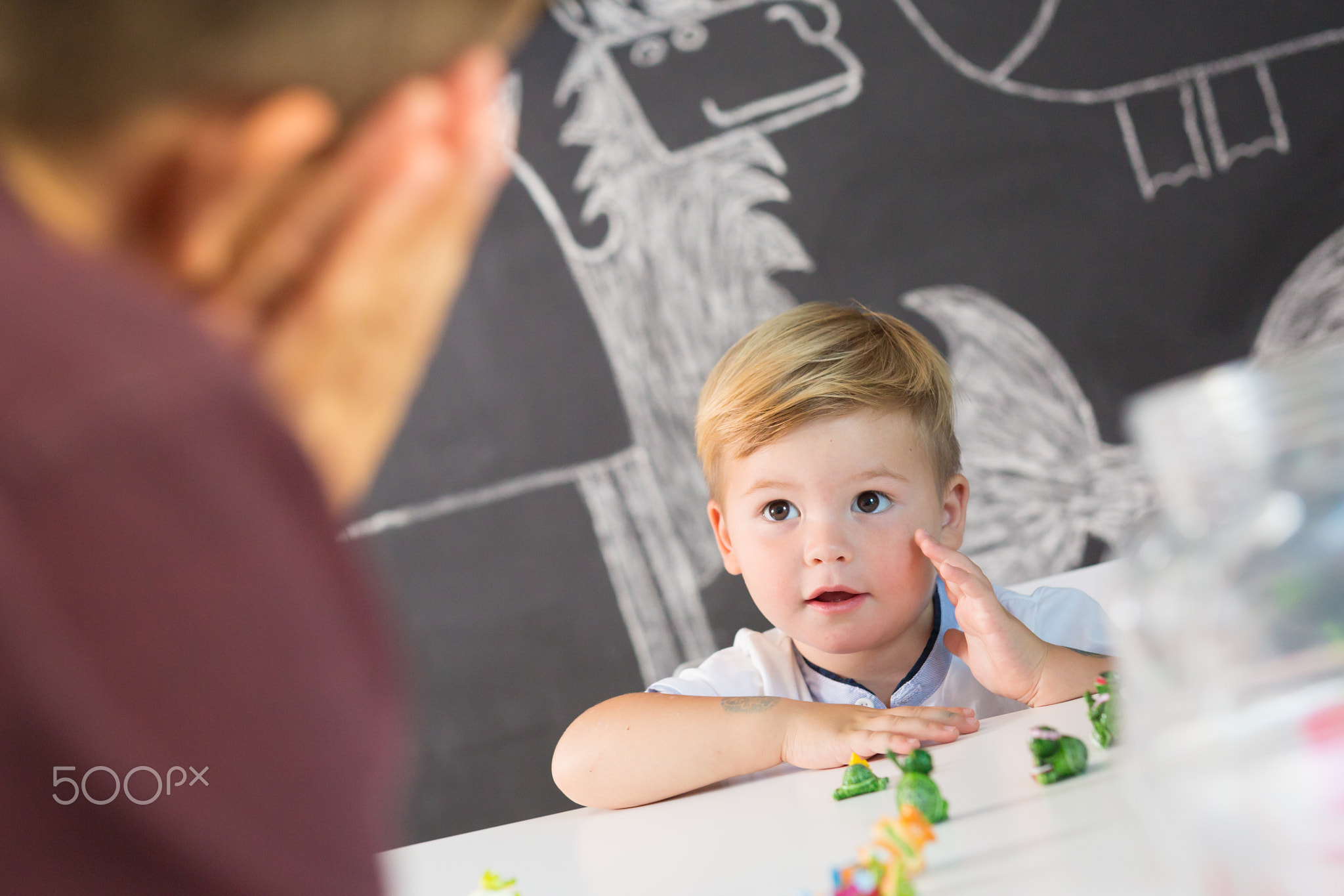 Cute little toddler boy at child therapy session.