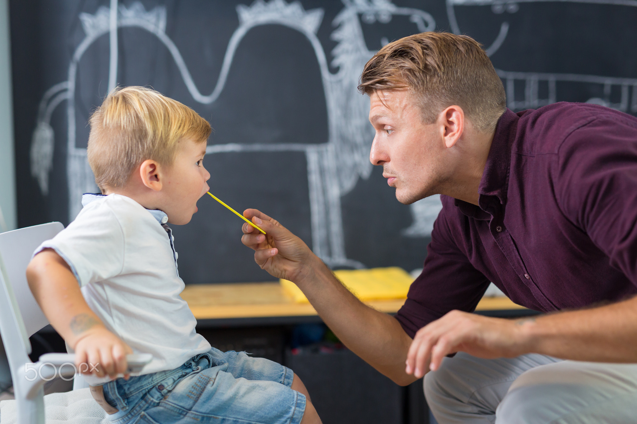 Cute little boy at speechtherapist session.