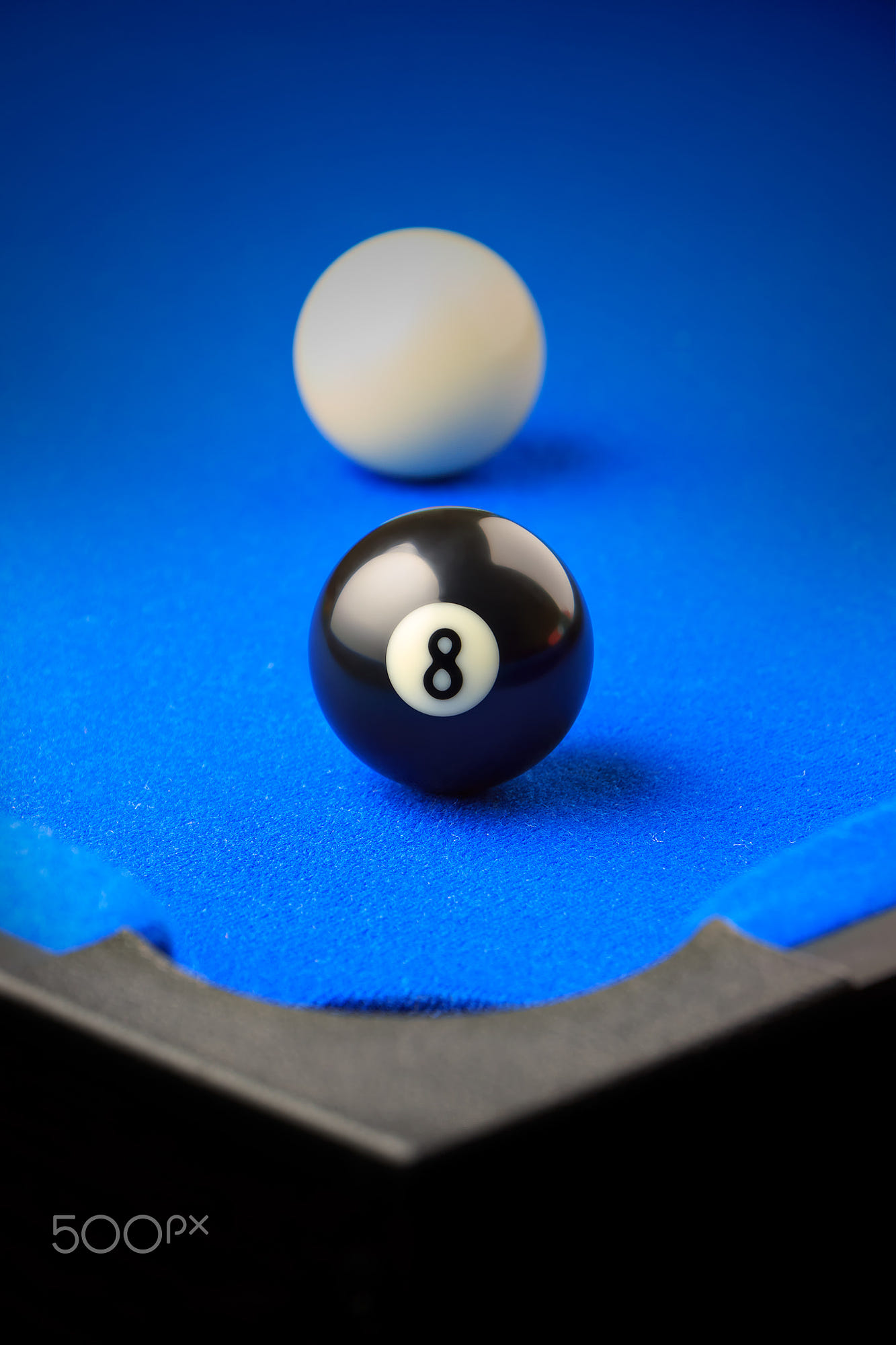 Match ball. Game over.: Match ball. Black eight ball in the pocket. Vertical image.