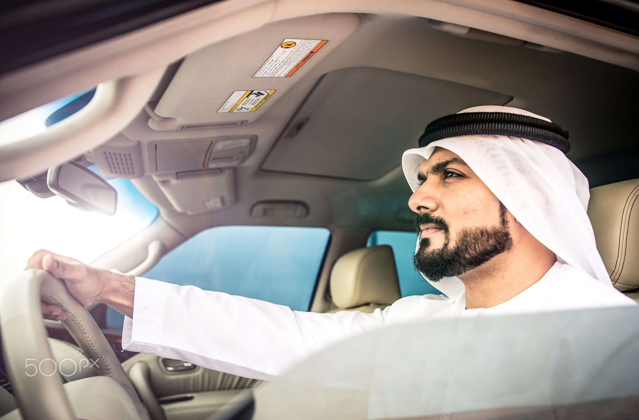 Arabic man in his luxury car