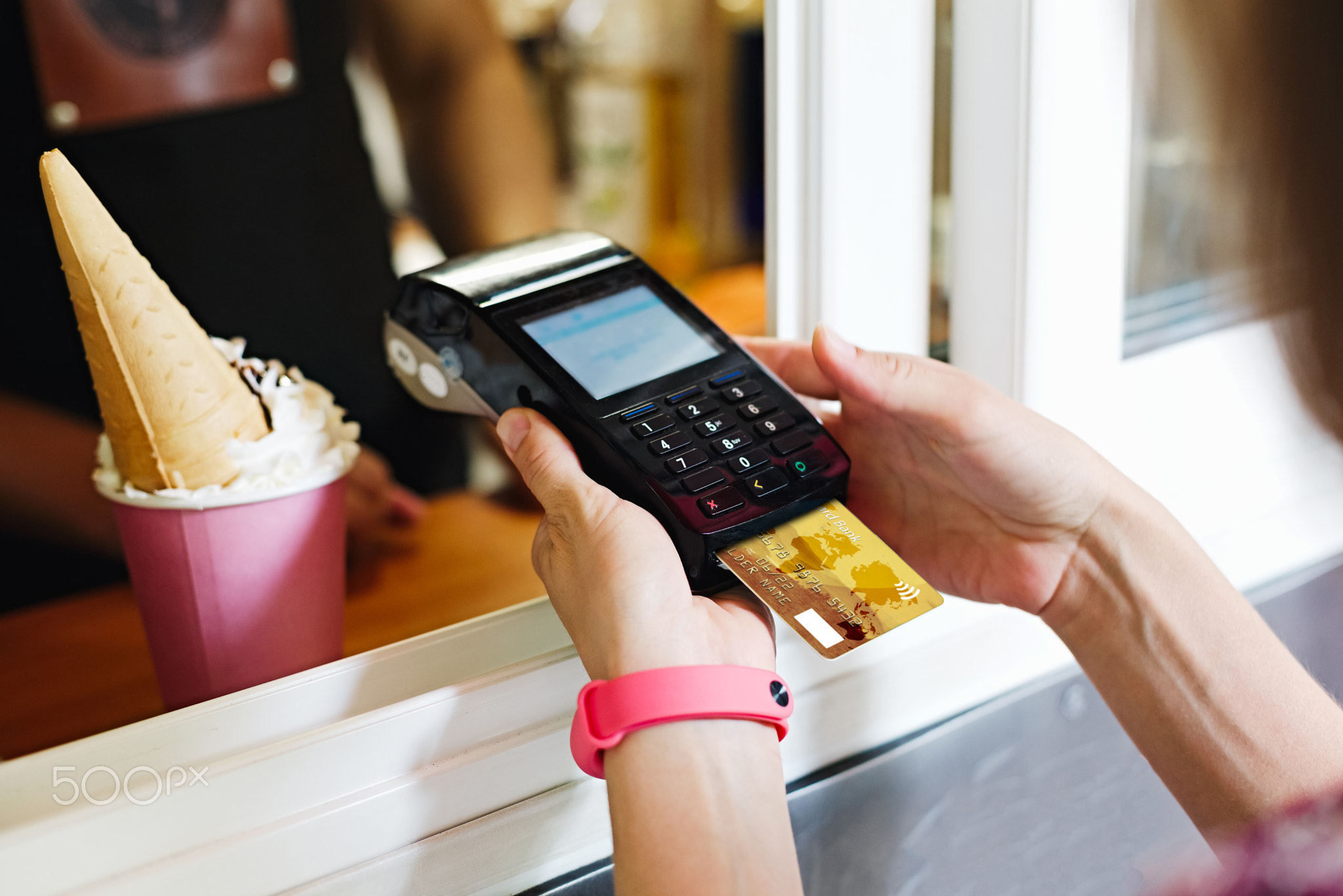 Person paying bill in cafe