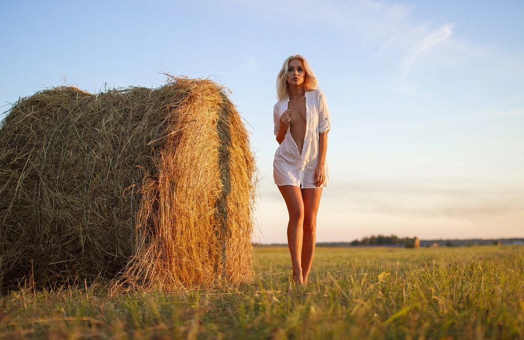 beautiful girl on the field with stacks by Evgen xvalko on 500px.com