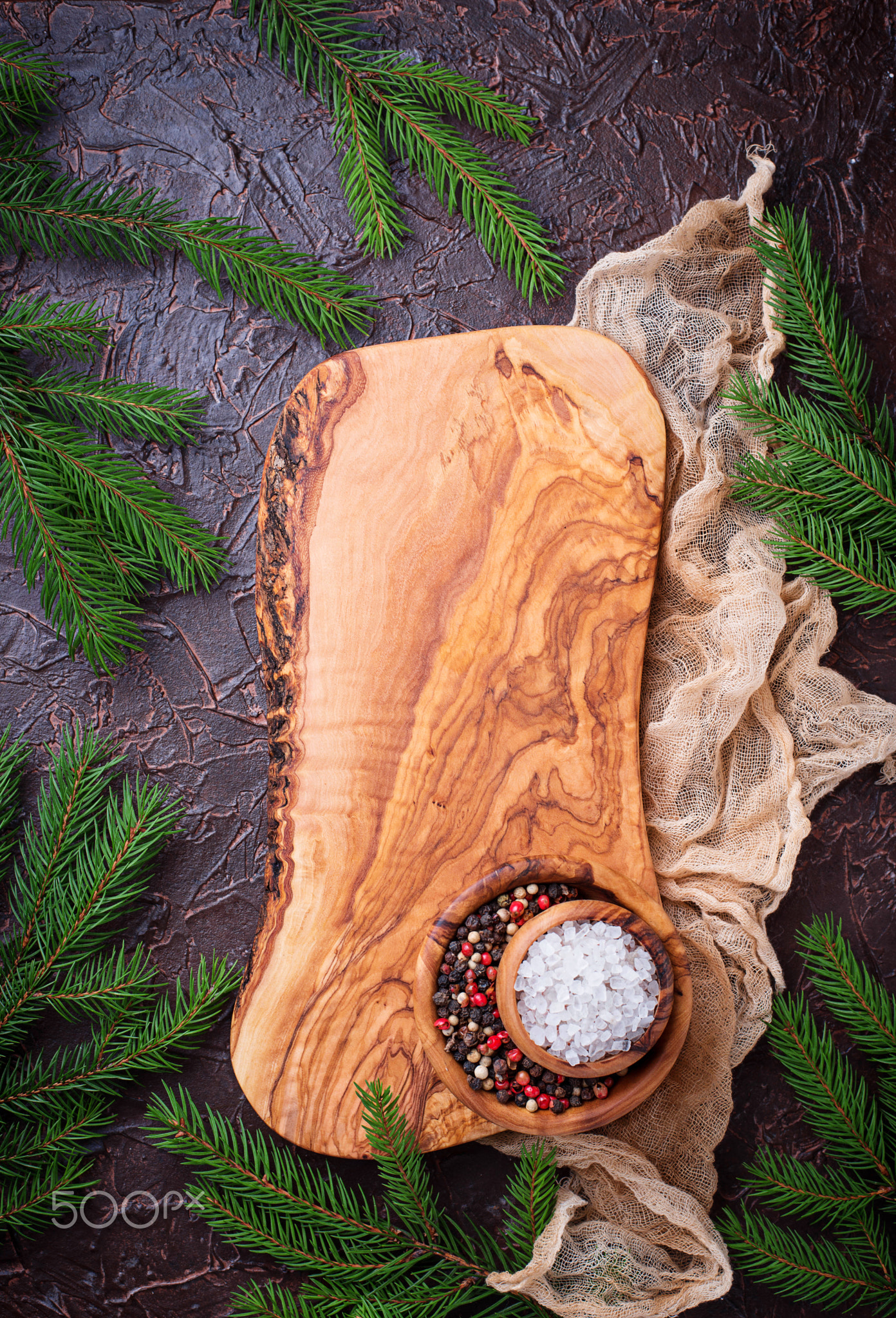 Christmas cooking background with cutting board and spices