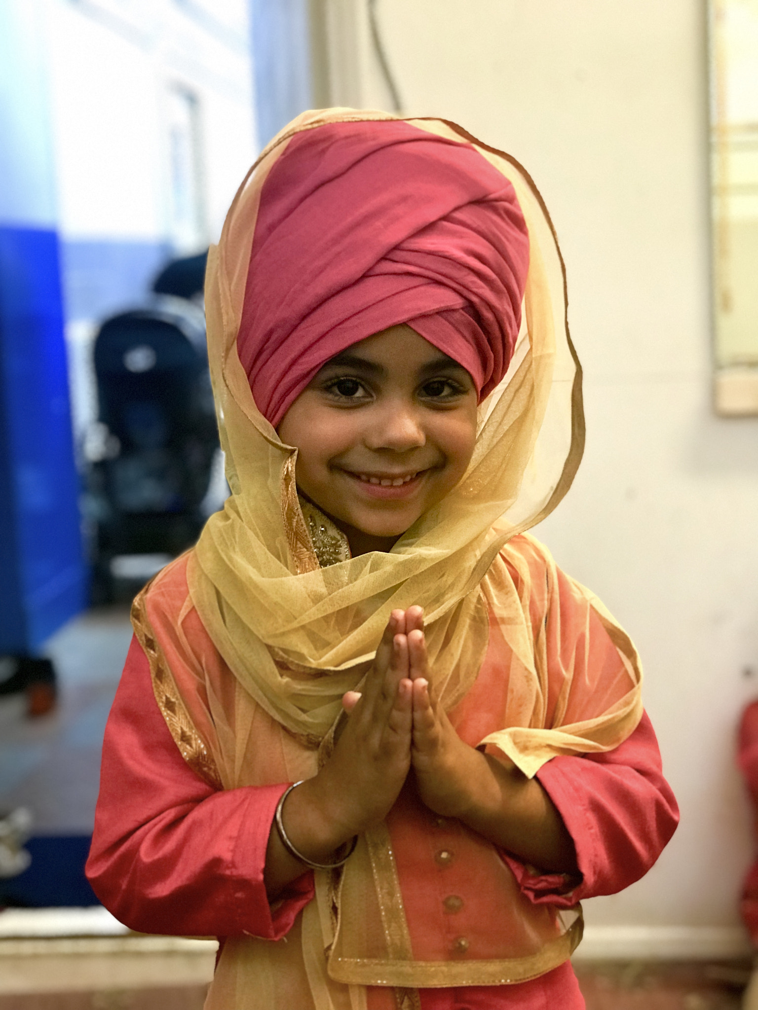 A small girl in a turban.