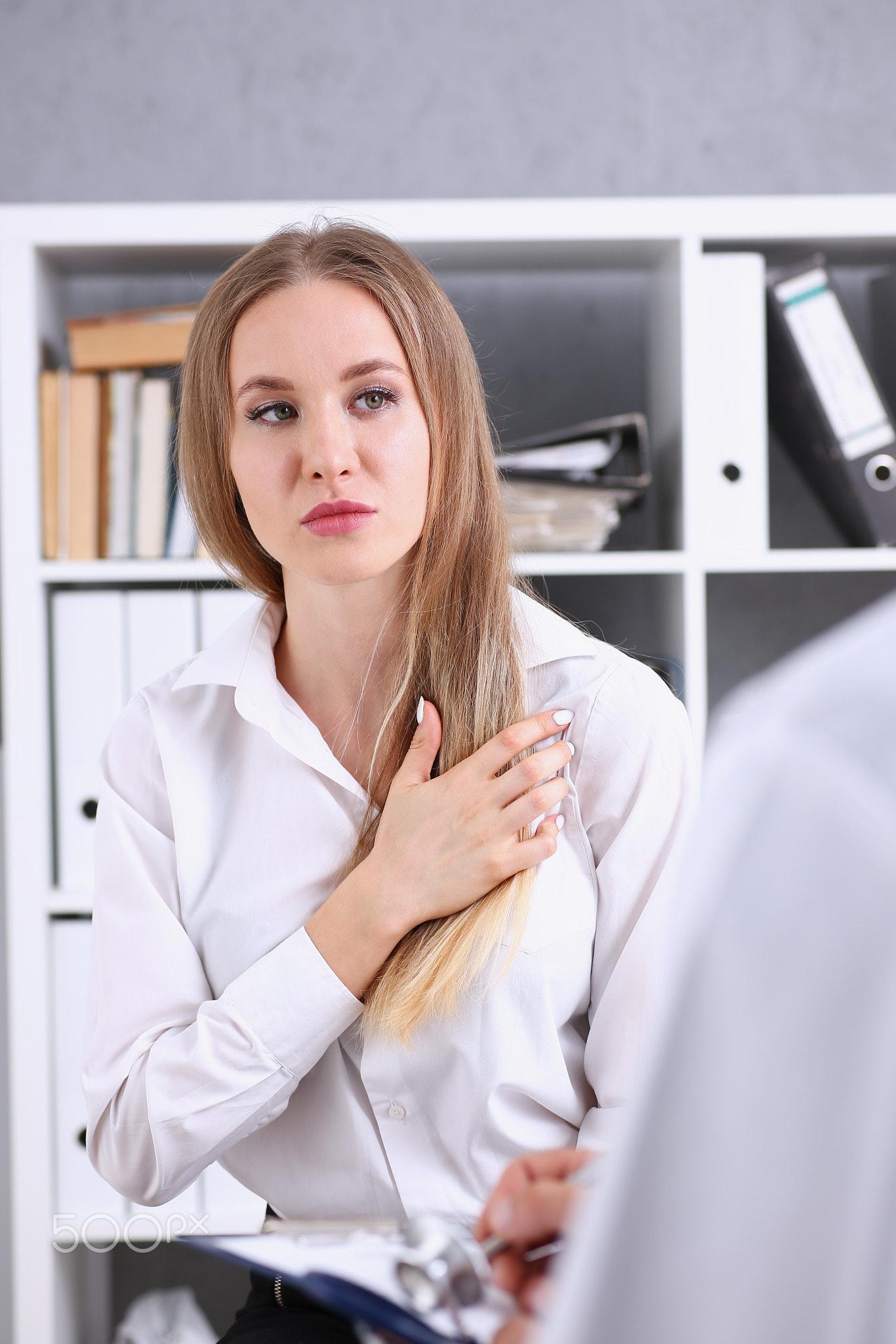 Concerned female visitor portrait talk with doctor