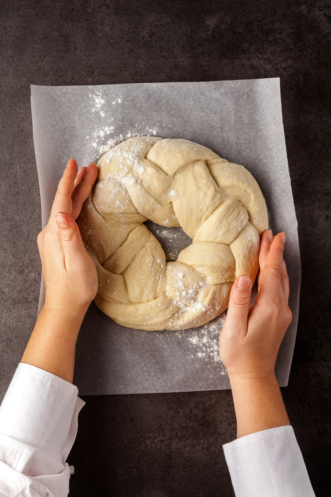 Preparation of the round braided challah bread and women's hands by Irina Grigorii on 500px.com
