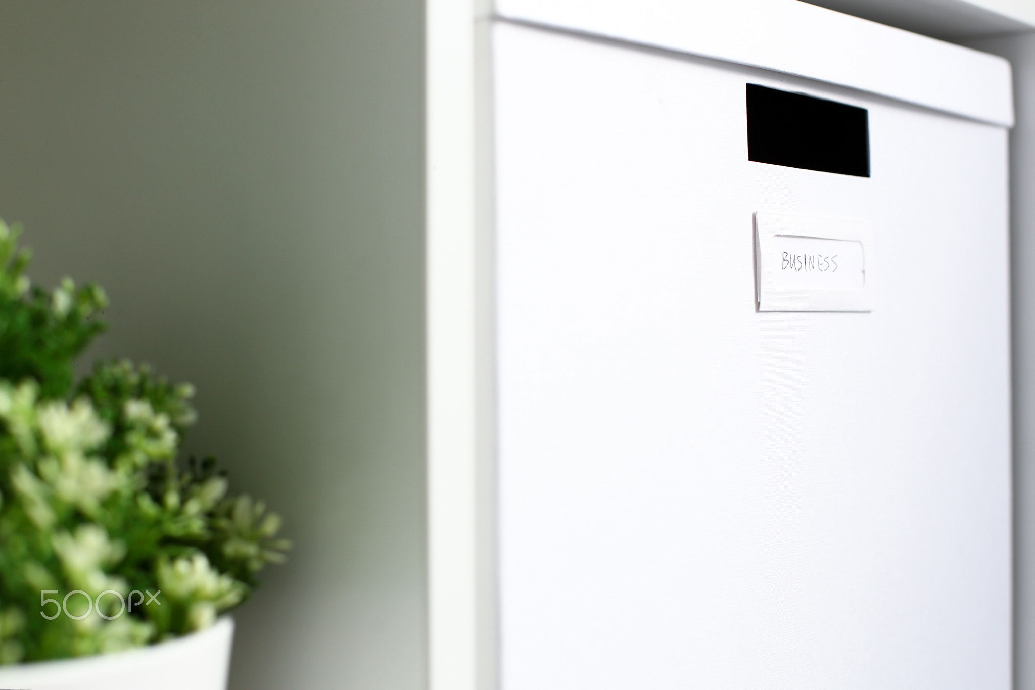 White cardboard box with business sign