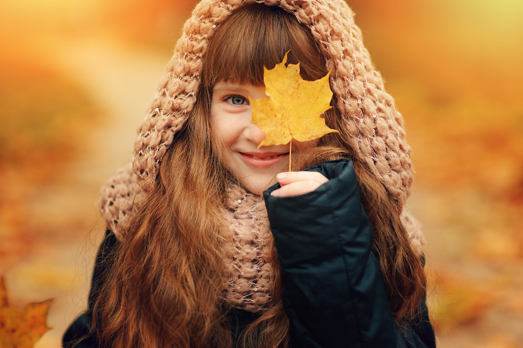 autumn outdoor portrait of beautiful happy child girl walking in park or forest in warm knitted... by Maria Kovalevskaya on 500px.com