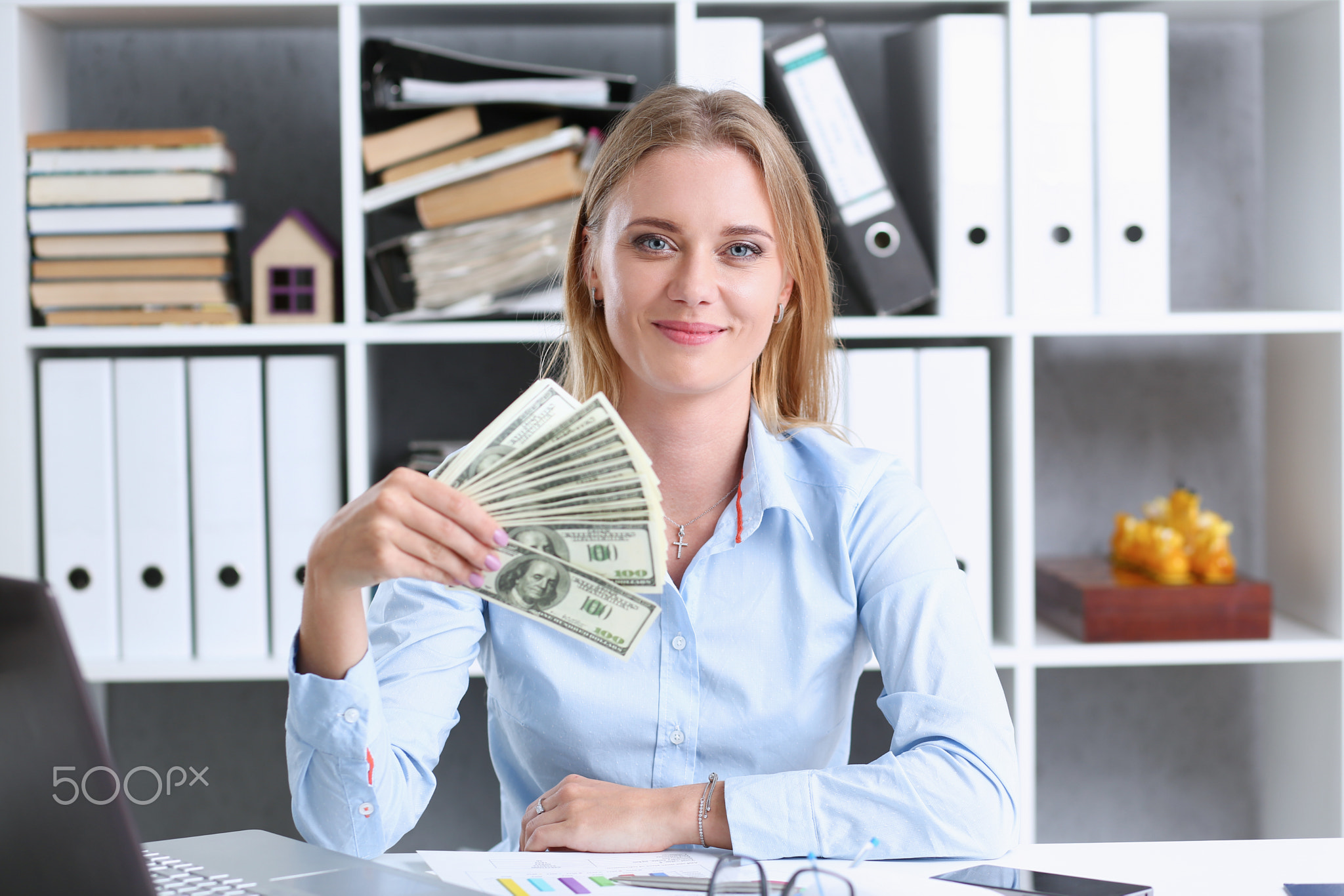 Beautiful businesswoman portrait. Scattering money