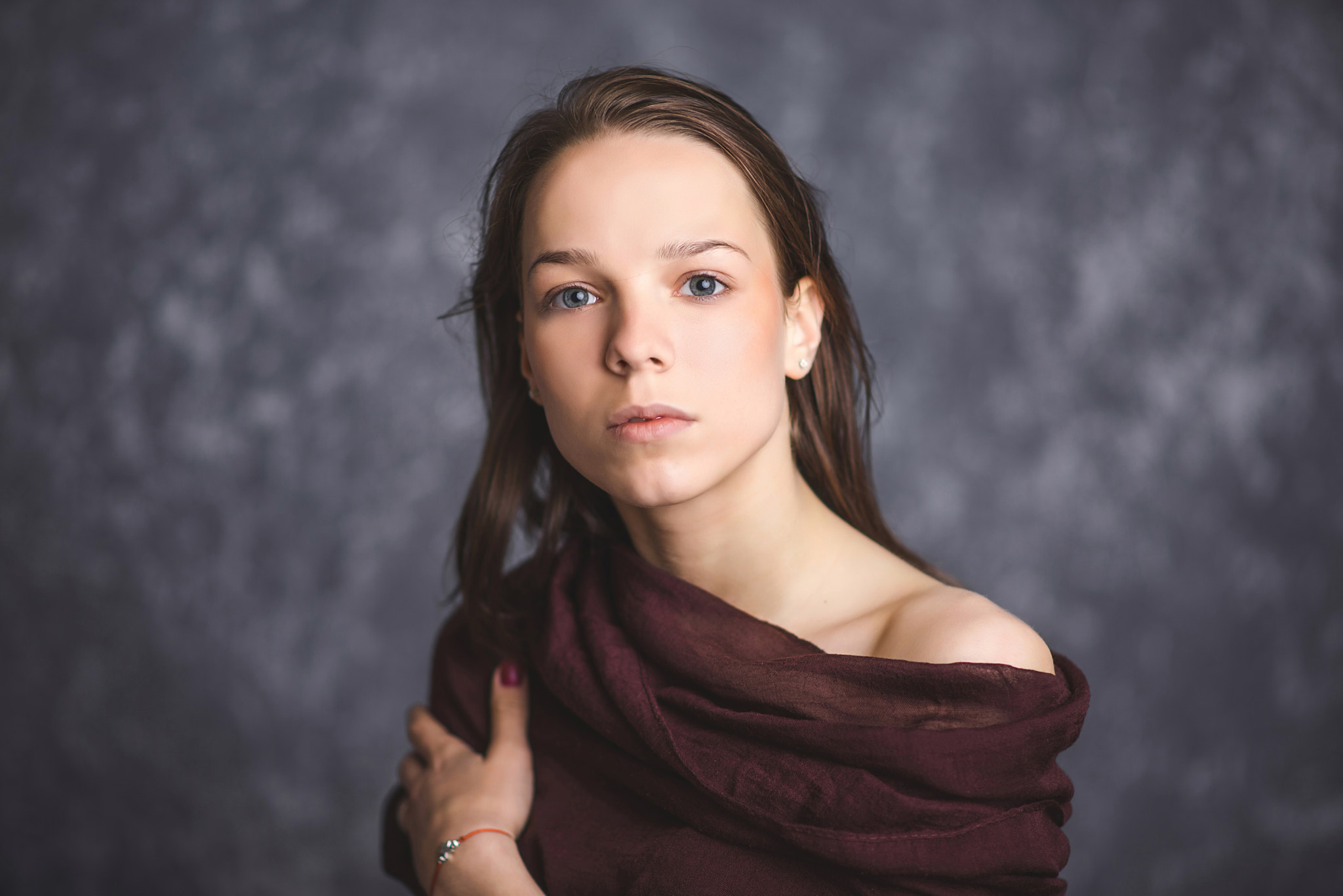 Portrait of a young brunette with sad and serious