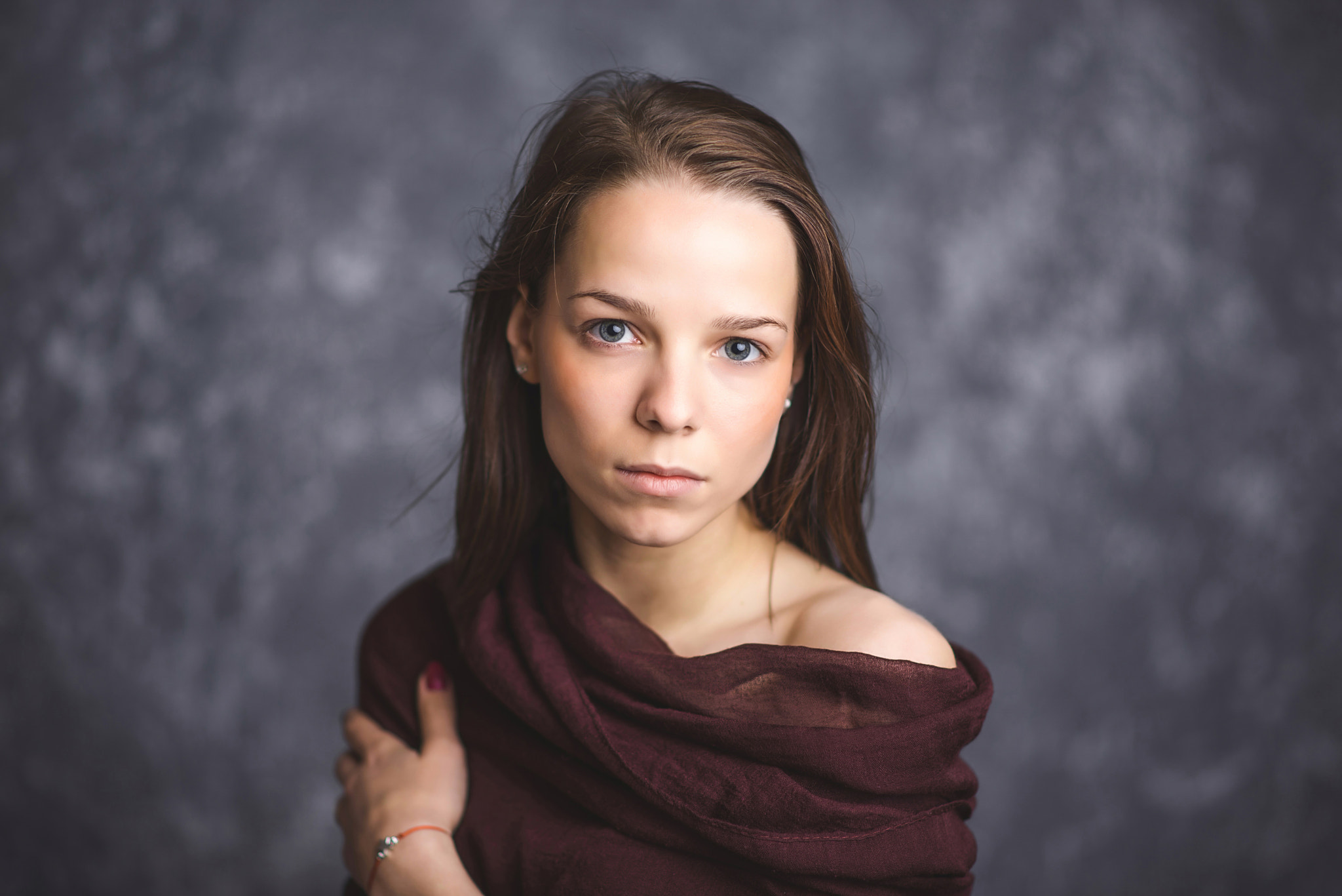 Portrait of a young brunette with sad and serious