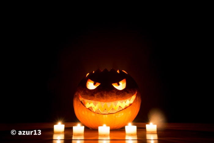 Candlelight halloween pumpkin with fire eyes mouth