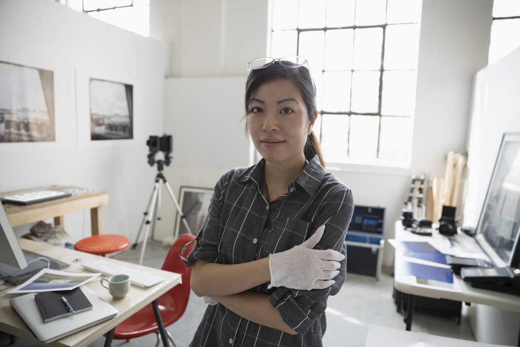 Portrait confident female photographer in art studio by Hero Images Hero Images on 500px.com