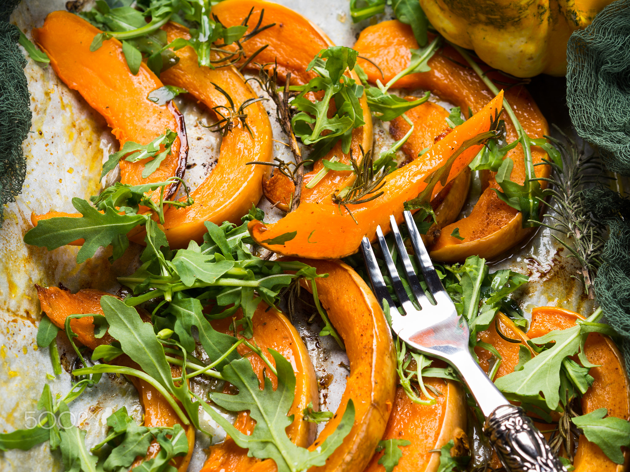 Baked pumpkin slices on tray