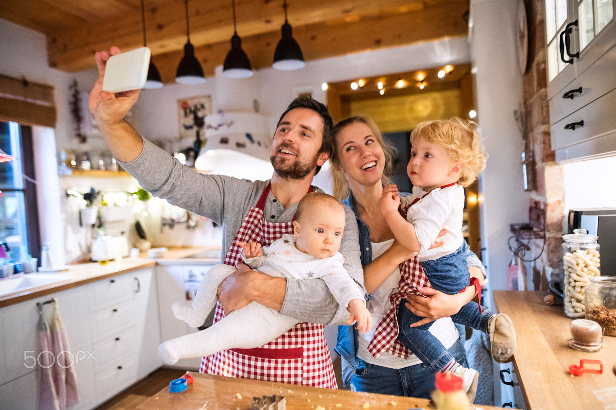 Young family making cookies at home.