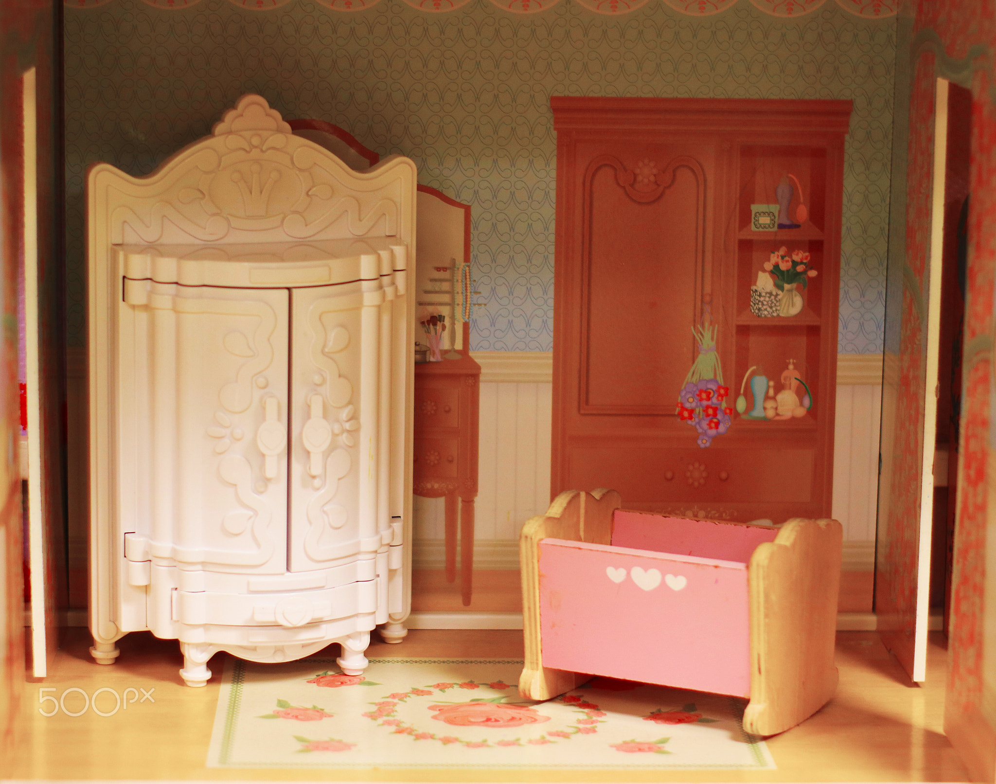 Vintage interior of baby dollhouse. Cute tiny doll room with clo