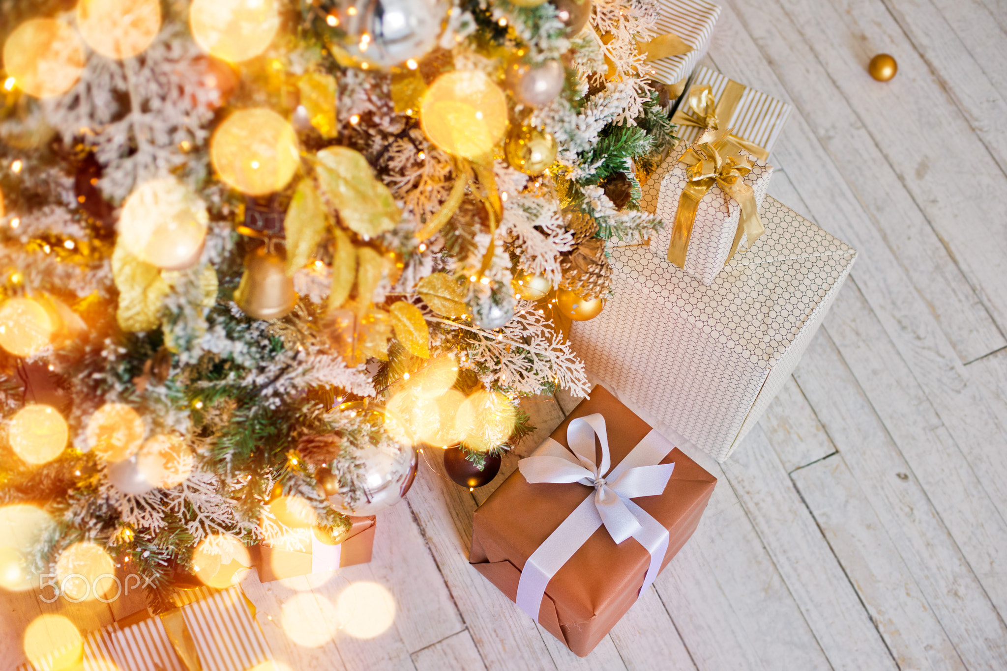 gifts lying on the floor near the Christmas tree