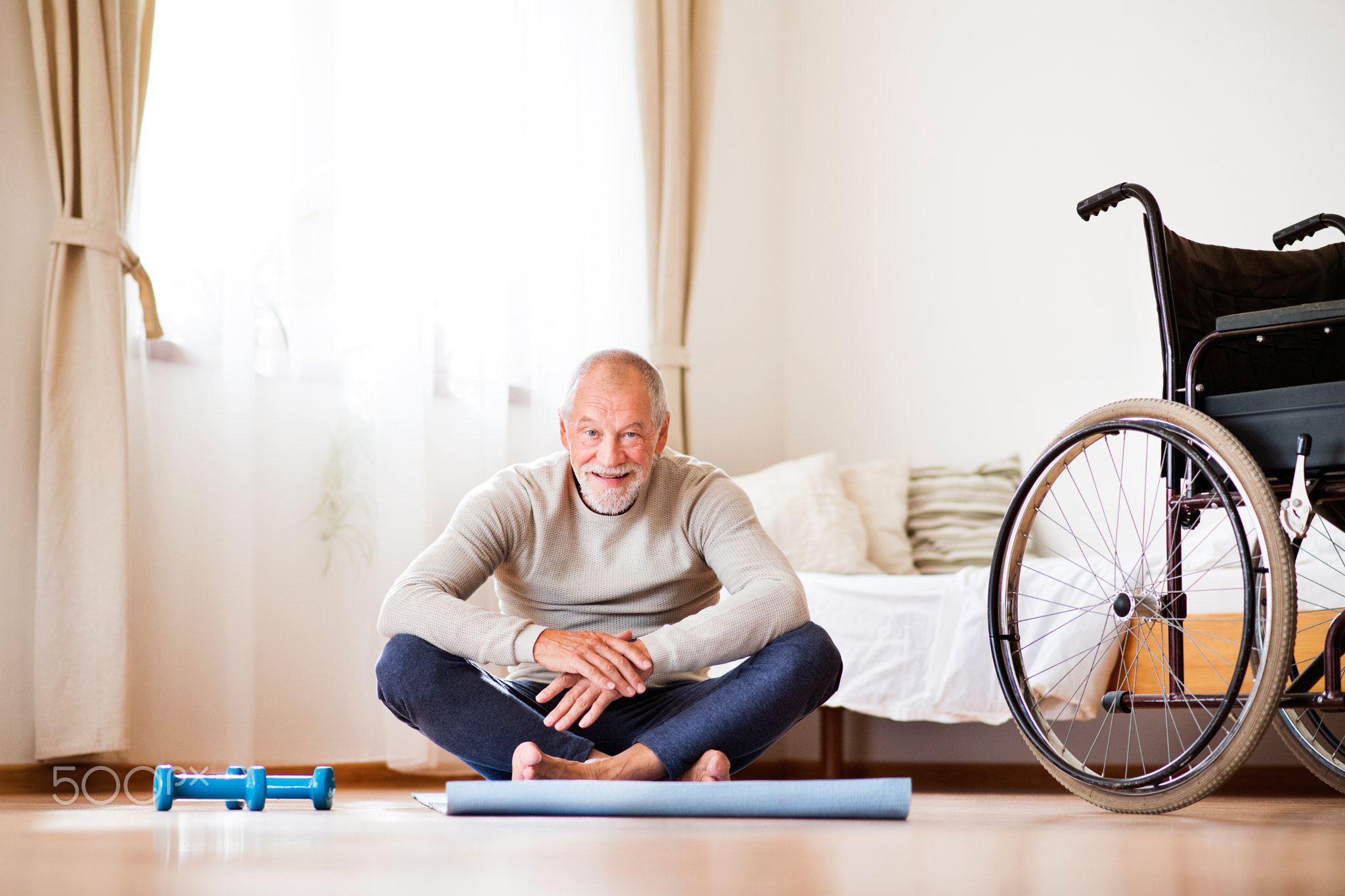 Senior man doing exercise at home.