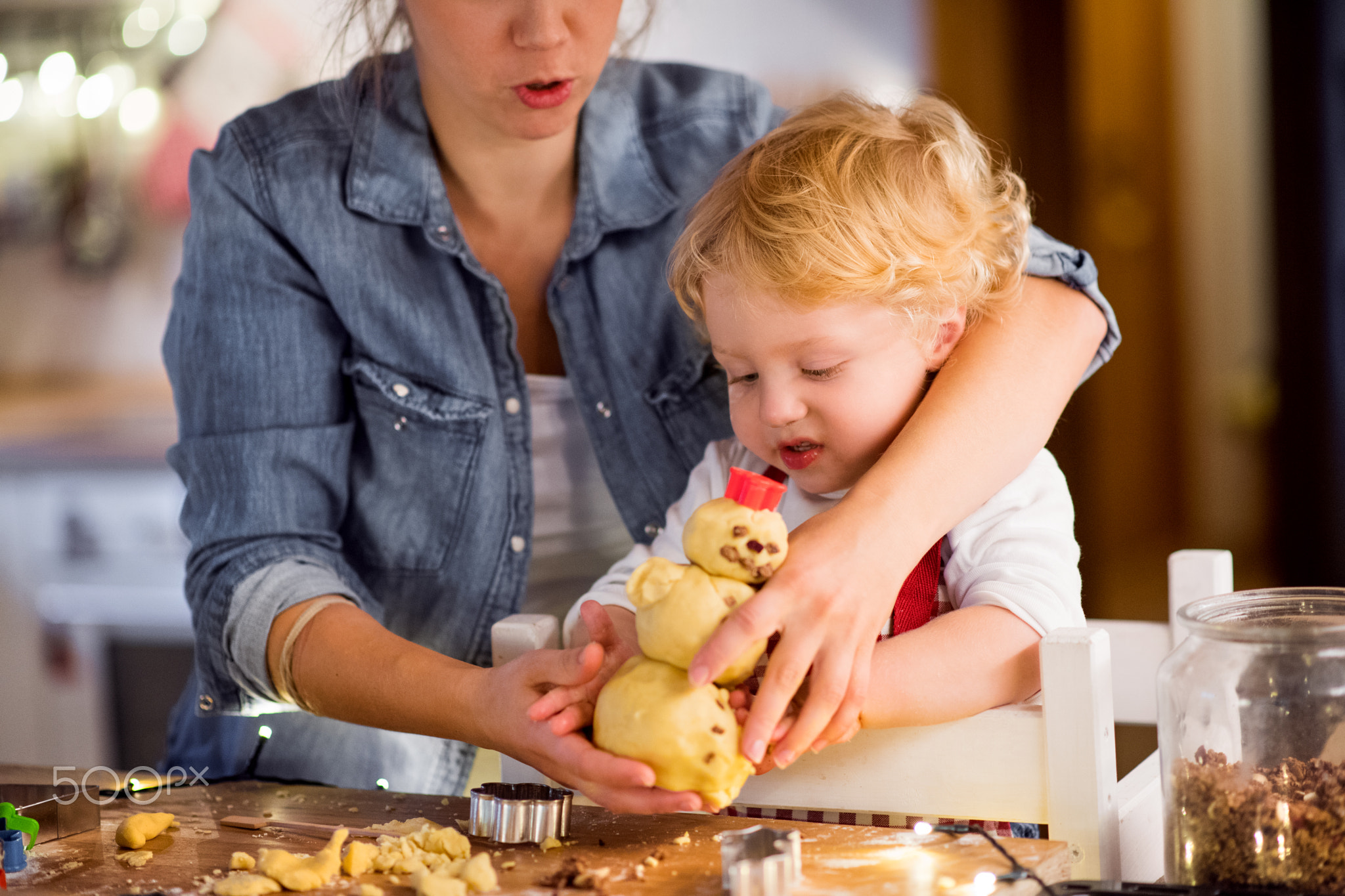 Young family making cookies at home.