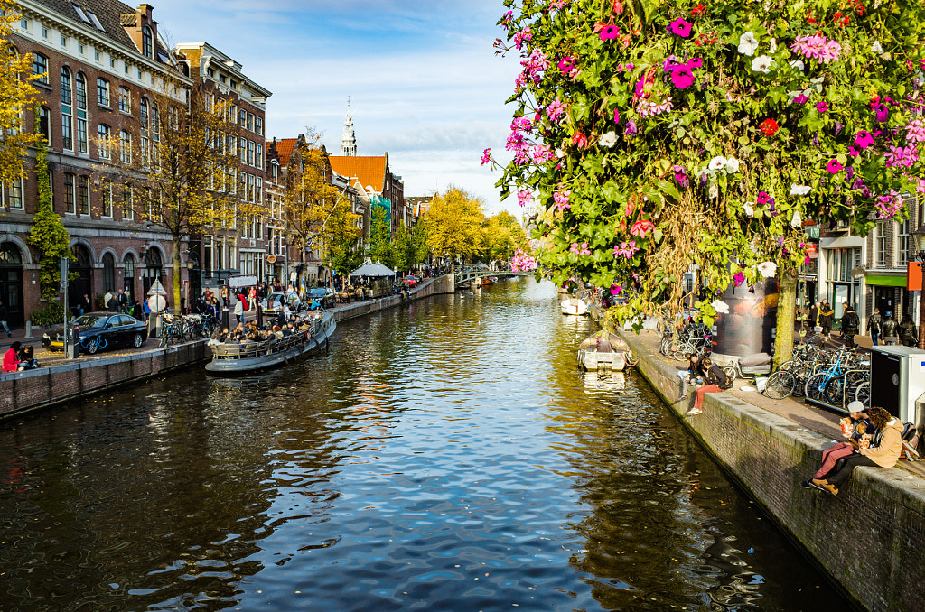 Flowers near canal in Amsterdam, Netherlands by Ilya Kurlin on 500px.com
