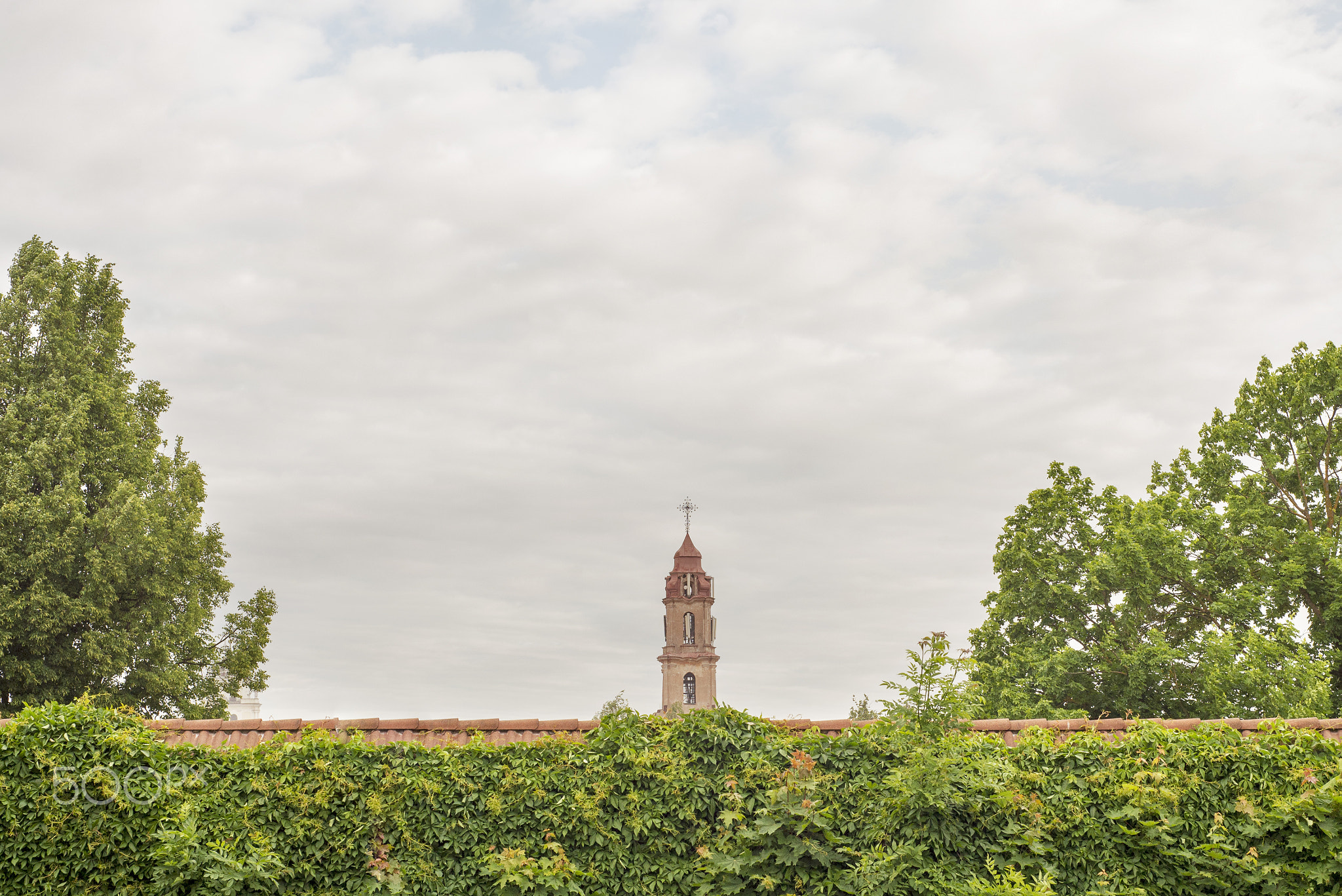 church tower behind the red wall