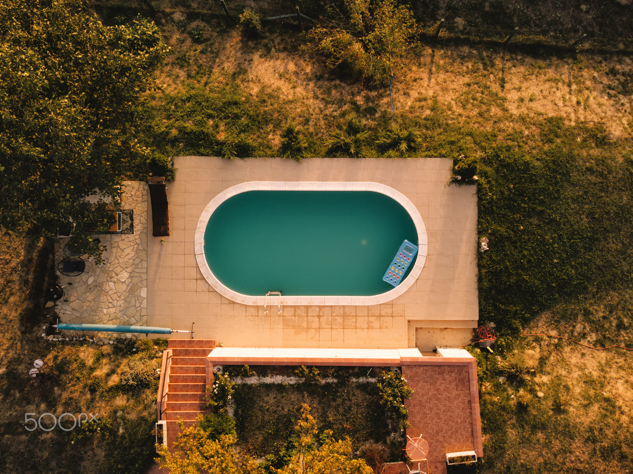 Aerial view of house backyard with swimming pool