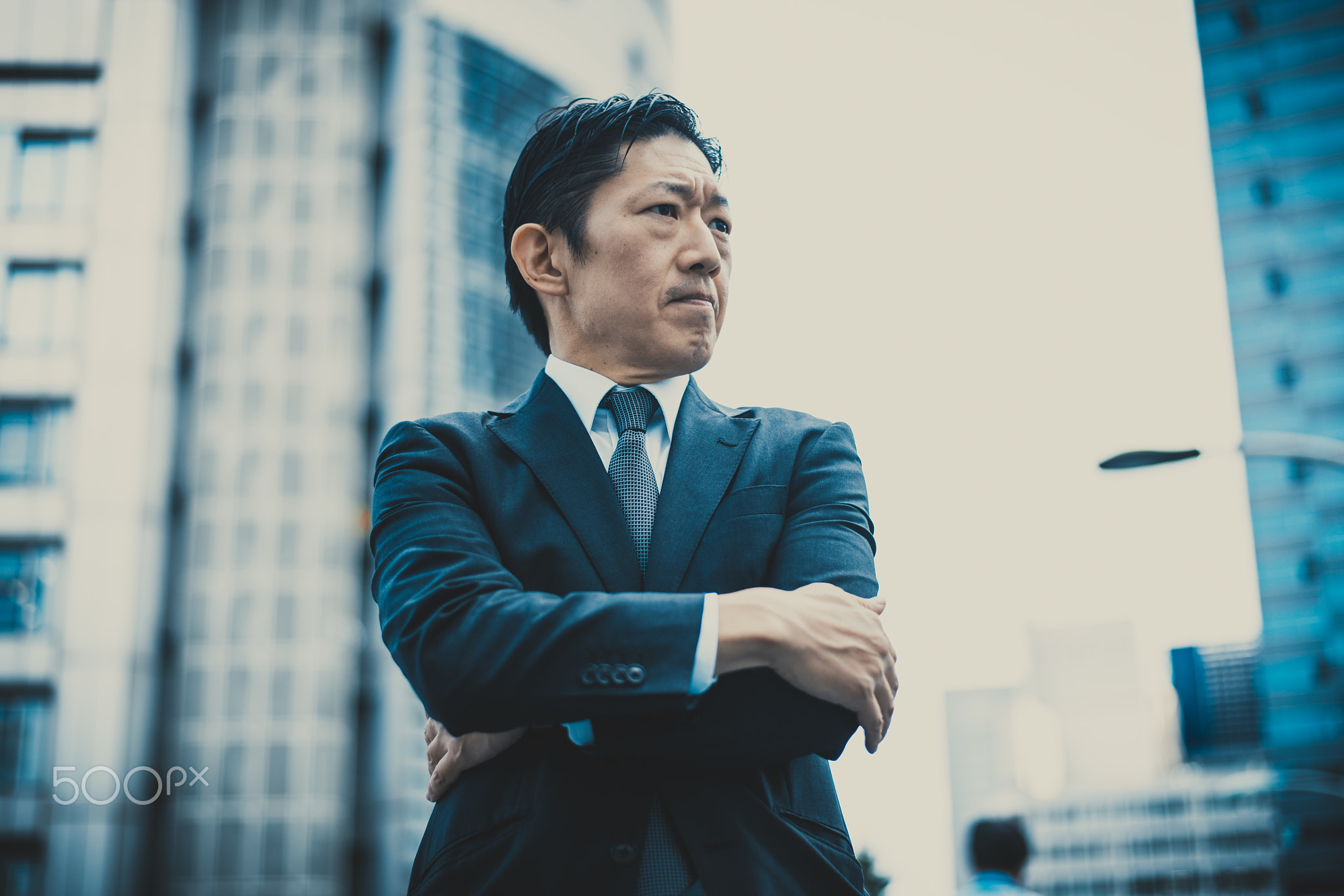 Senior business man moments on the streets of Tokyo