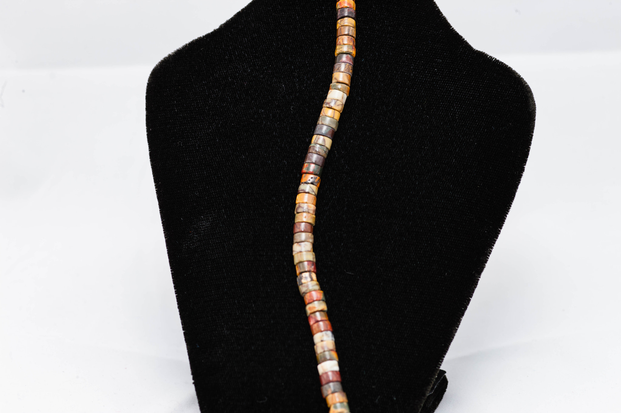 strand of medium sized round multi colored beads