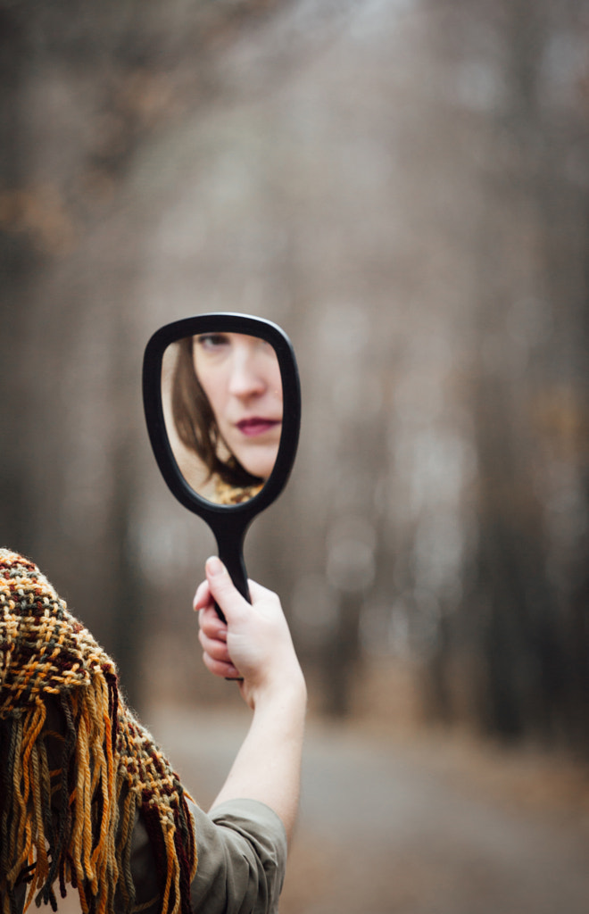 Woman holding a mirror in a autumn forest by Gabriela Tulian on 500px.com