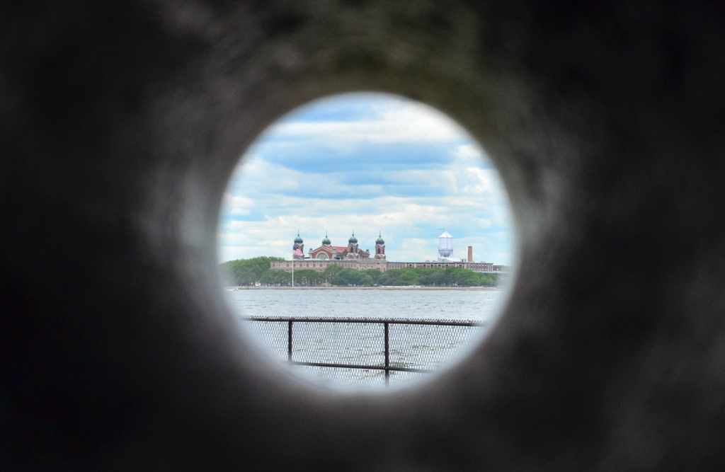 ellis island through the gap by pronate on 500px.com