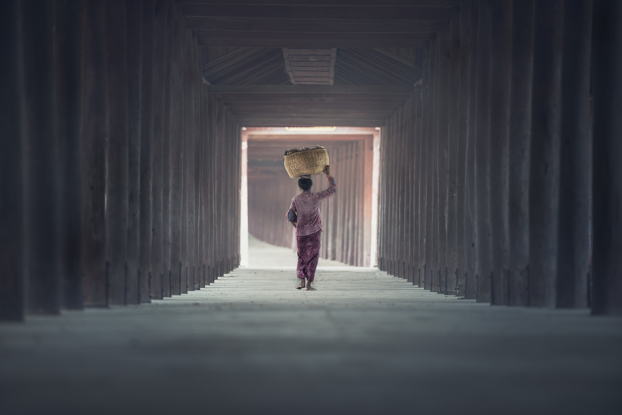 Woman walks along the walkway