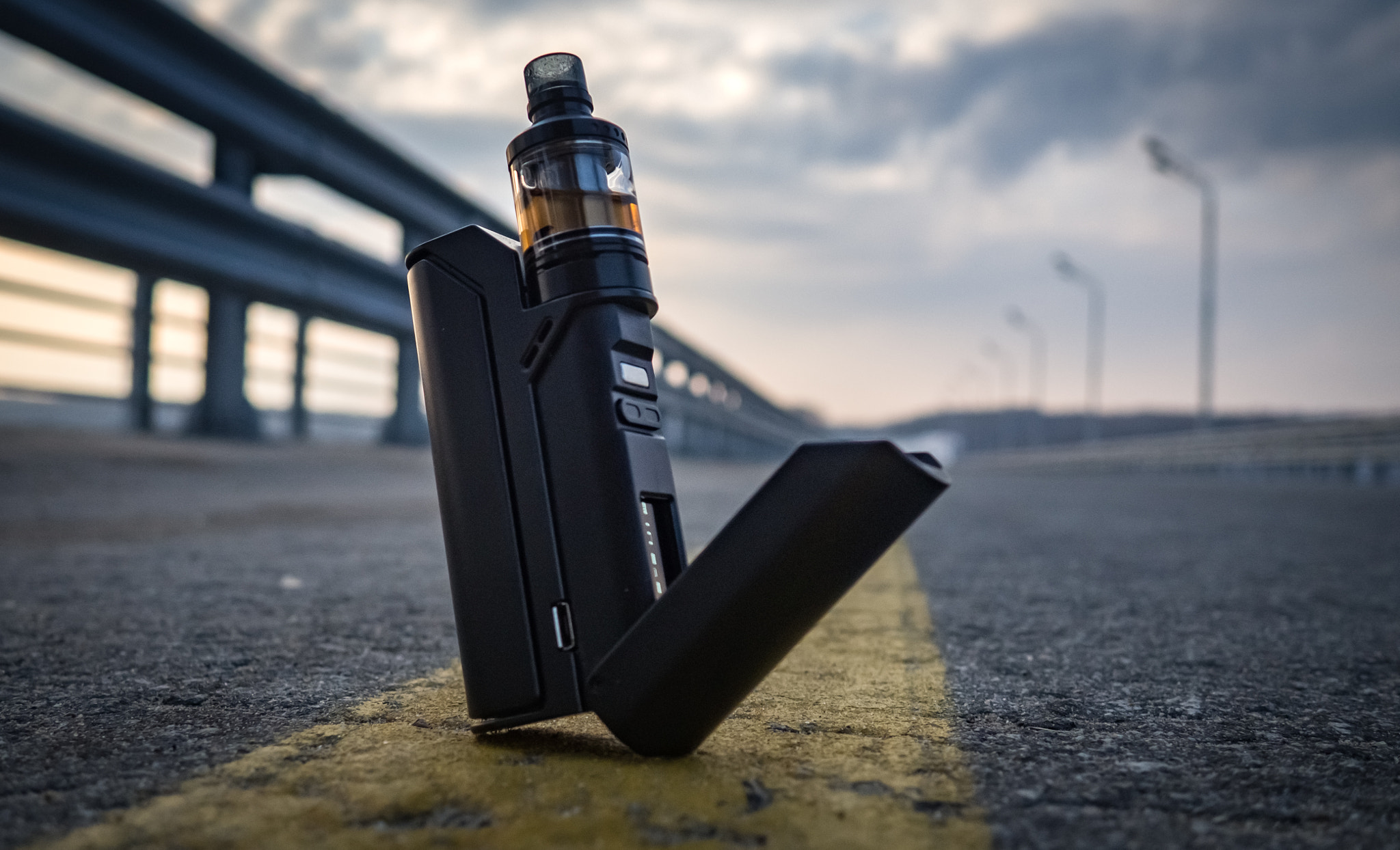 vaporizer on the background of the road and clouds