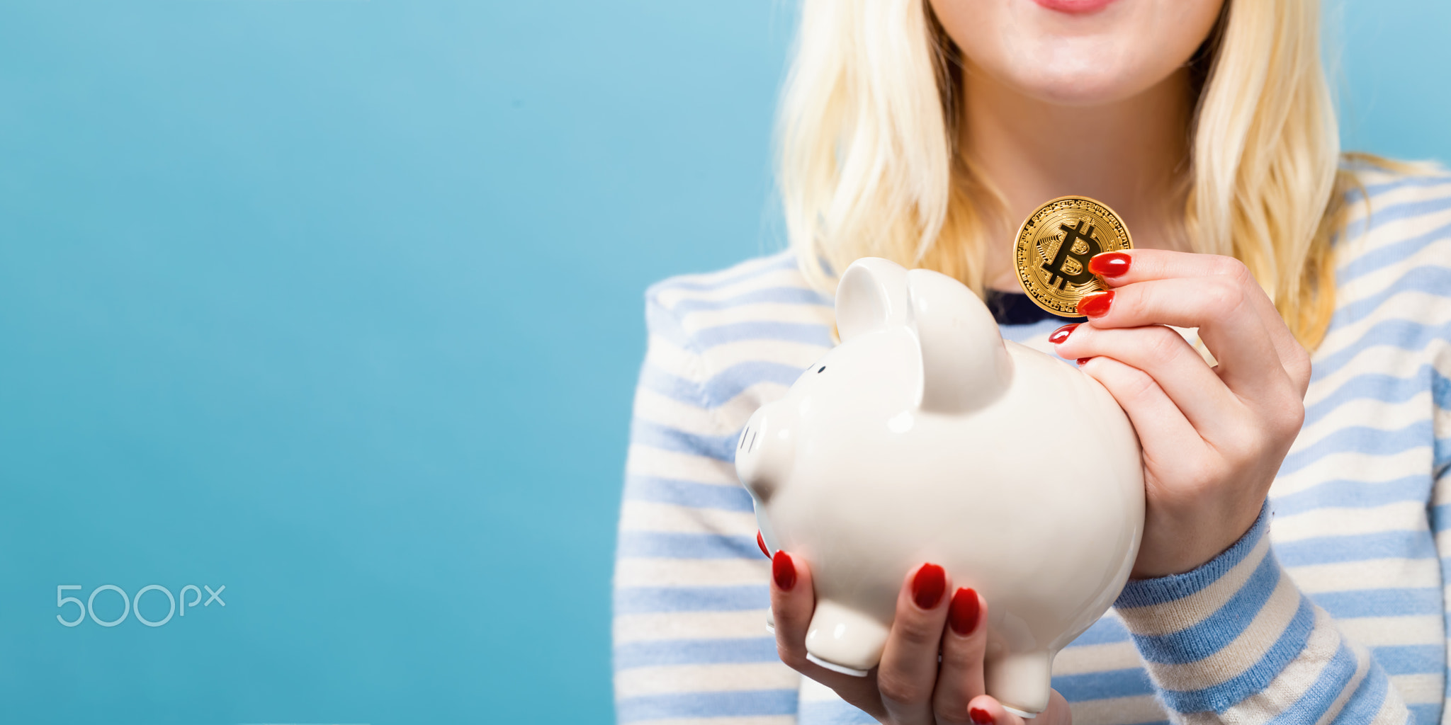 Woman with bitcoin and piggy bank