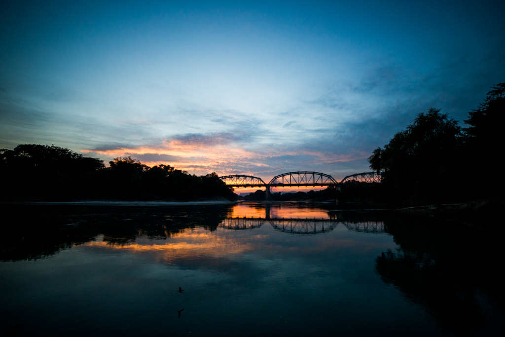 Sunset over (and under) Tampoán bridge and a watering bat. by alberto alcocer on 500px.com