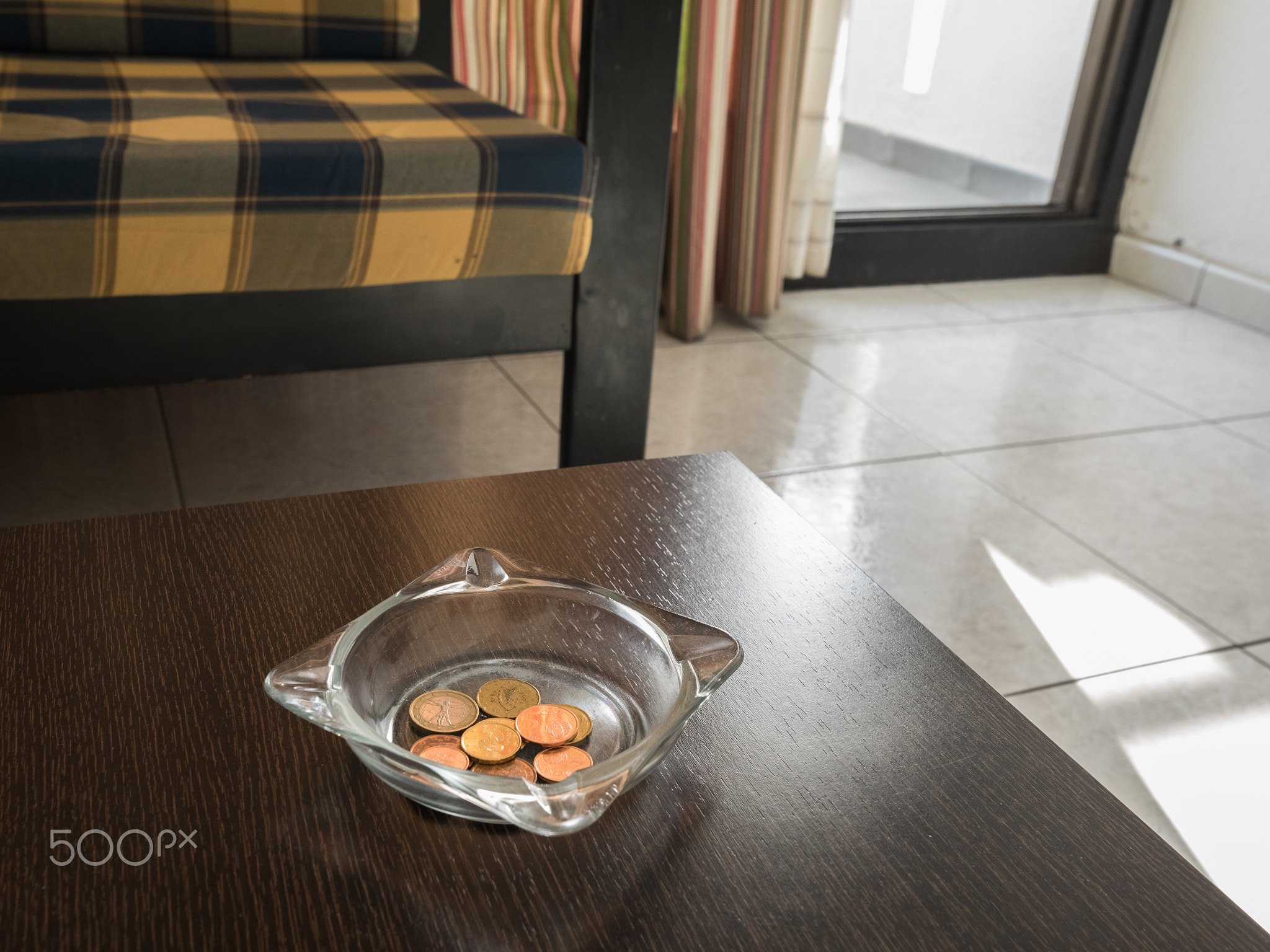 Tips in the ashtray on a hotel table