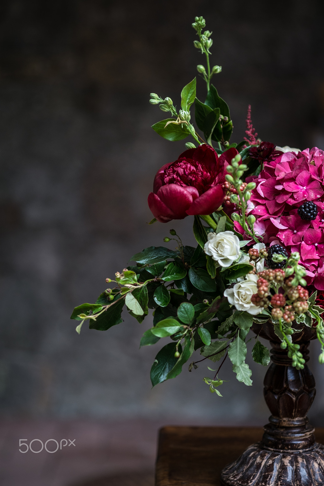 Wedding peony bouquet against vintage dark stone background. Rustic style.