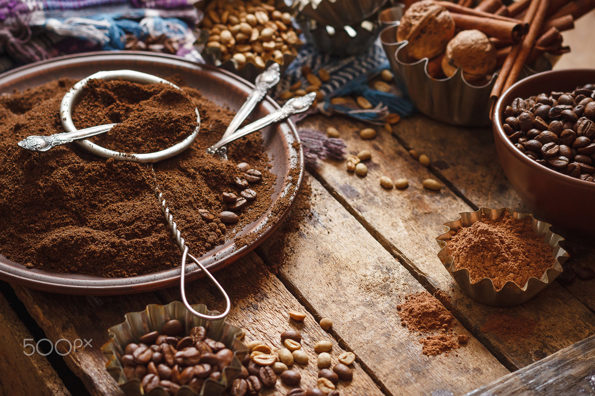 Roasted coffee beans and ground coffee in the plate