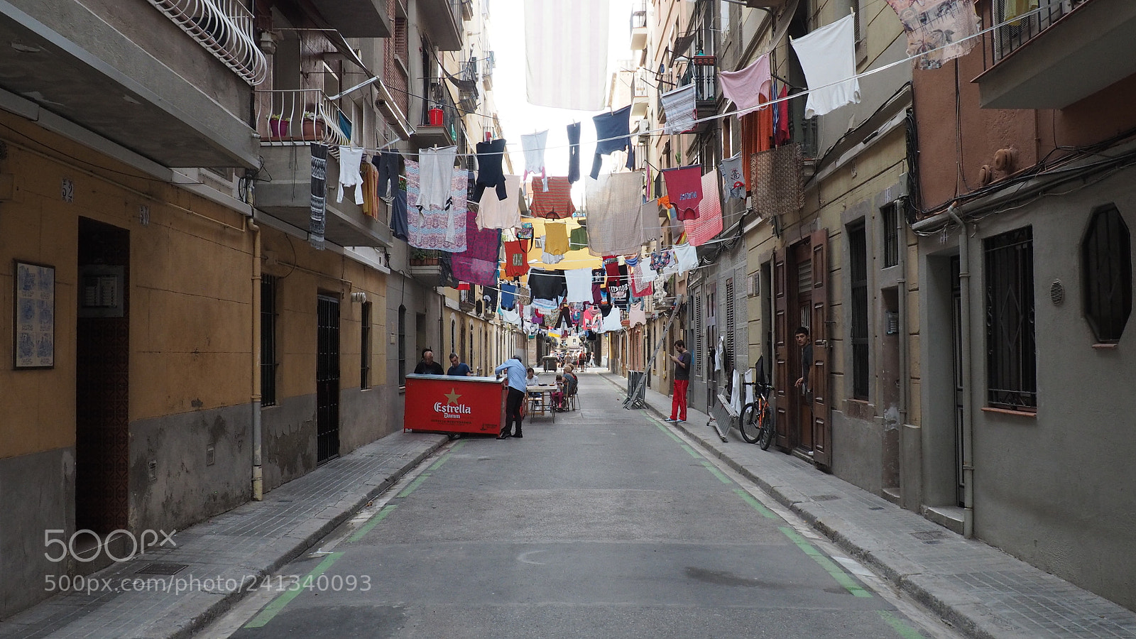 Olympus OM-D E-M10 sample photo. Street full of hanging photography