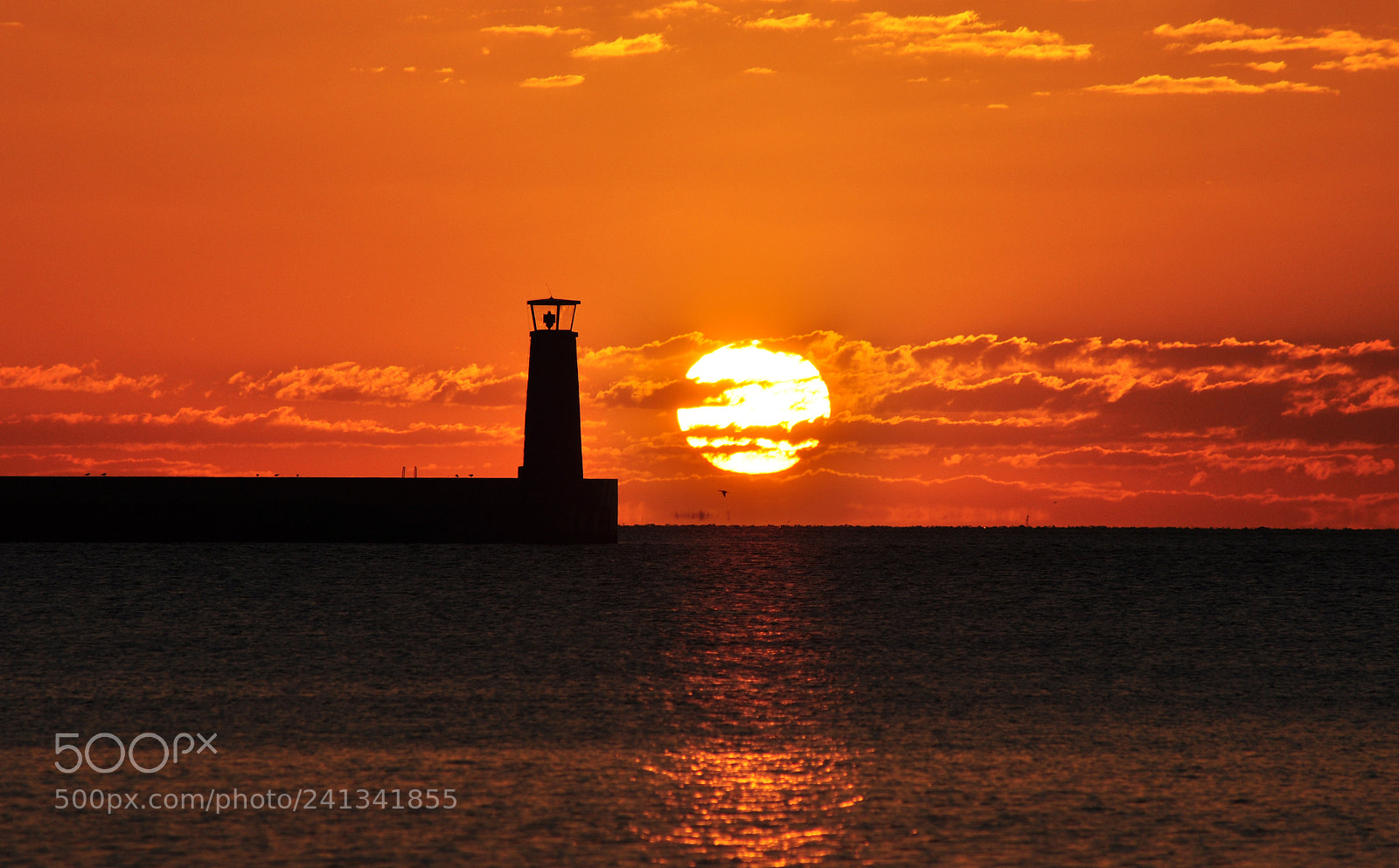 Nikon D5000 sample photo. Lighthouse silhouette during sunrise photography